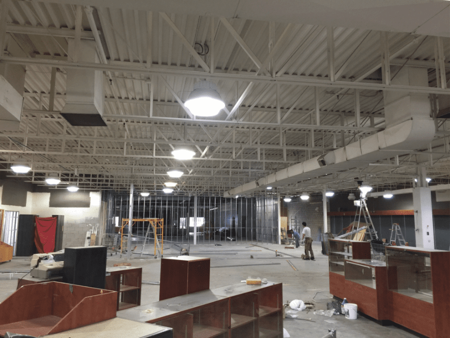 This outdoor equipment retail store renovation showcases a spacious open-concept layout with newly installed durable vinyl flooring, modern ceiling lighting, and custom display shelving. Reno Compass Inc. transformed the commercial space into a clean, functional, and customer-friendly retail environment, ideal for showcasing outdoor products while ensuring long-term durability and easy maintenance.