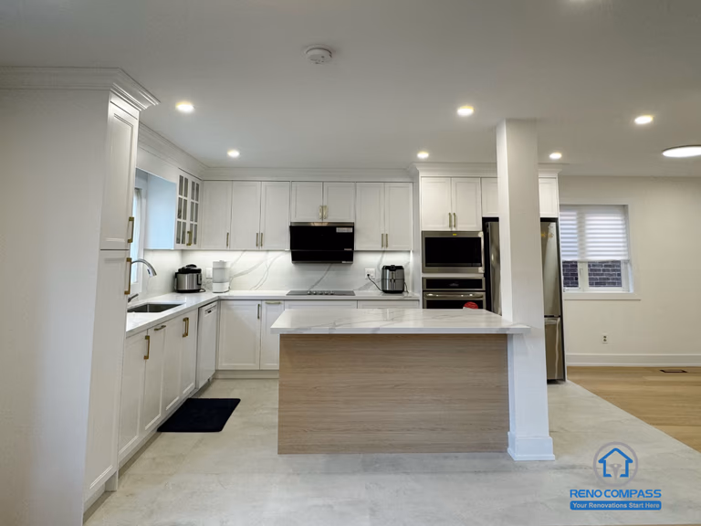 This Richmond Hill kitchen renovation showcases an open-concept layout with a central island that improves circulation and everyday usability. Custom white cabinetry, integrated appliances, and clean-lined finishes create a bright and cohesive cooking space. Thoughtful lighting and balanced proportions enhance both function and visual clarity, making this kitchen a seamless part of the overall Toronto renovation focused on comfort, durability, and long-term living quality.