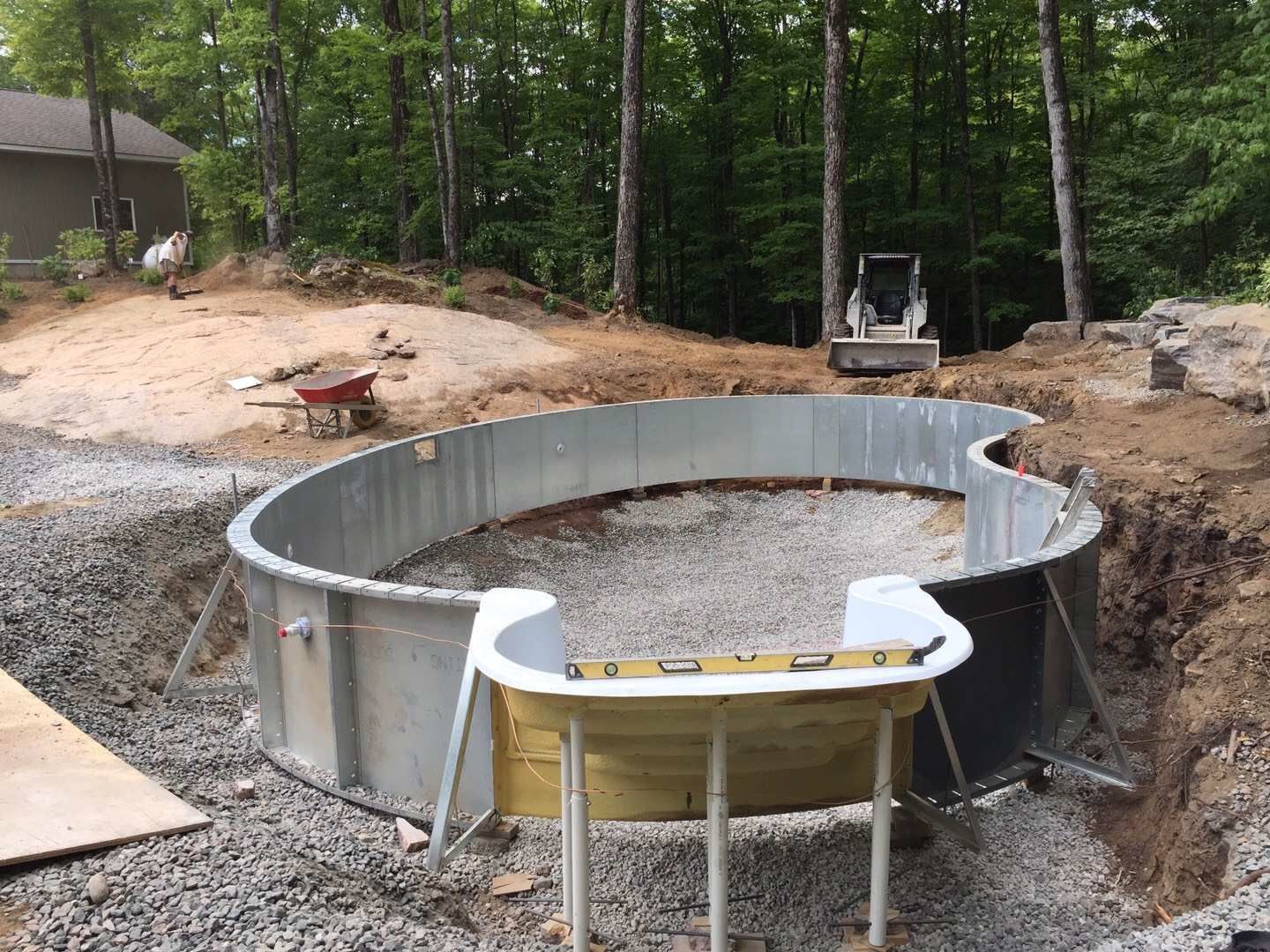 Custom backyard swimming pool construction in Toronto featuring professional steel pool structure installation and foundation preparation. This stage highlights precise pool framing, base leveling, and site grading to ensure long-term durability and structural stability for a high-quality residential swimming pool project.