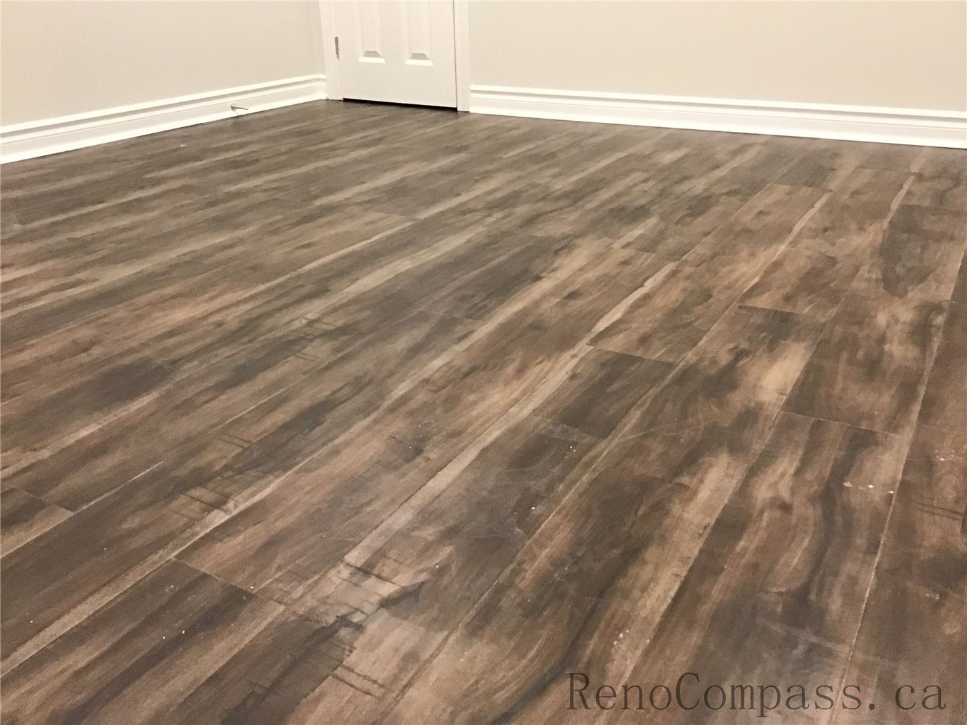 This Whitby basement renovation includes the installation of durable wood-look vinyl plank flooring, adding warmth and texture to the finished space. The rich brown tones and natural grain patterns create a cozy atmosphere while offering moisture resistance and long-lasting performance — an ideal flooring choice for modern basement living areas or bedrooms.

If there are more images for this Whitby Basement Renovation project, send them over and I’ll complete the full SEO set for you.