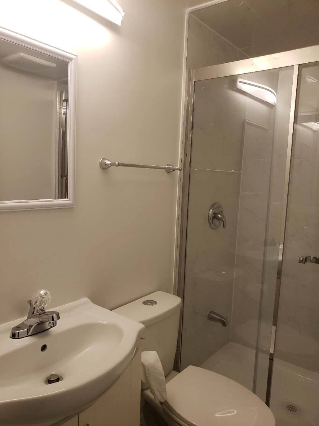 This Markham basement bathroom renovation features a modern glass-enclosed shower with clean tile finishes and updated plumbing fixtures. The space is designed for practicality and durability, incorporating a clear sliding glass door, neutral wall tiles, and efficient lighting to enhance brightness in the basement environment. Compact layout planning ensures comfortable use while maintaining a clean and contemporary look. This professionally completed basement bathroom highlights quality workmanship and thoughtful design, making it a functional addition to a fully finished basement in Markham.