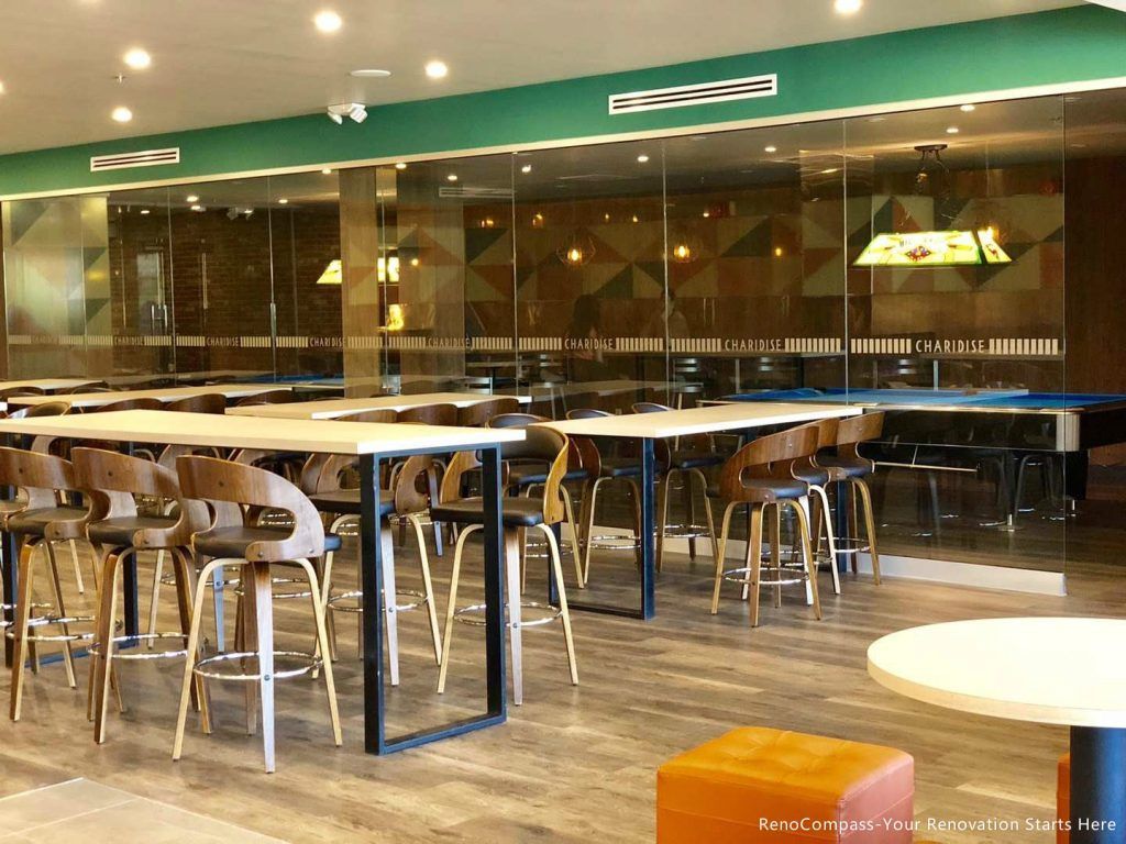 This Barrie commercial renovation features a modern bubble tea shop dining area with custom seating, durable flooring, and contemporary lighting design. The open layout and large glass storefront create a bright and welcoming environment for customers. Completed by Reno Compass Inc., a trusted Toronto renovation company, this project highlights professional commercial construction tailored for cafés, bubble tea shops, and retail spaces.
