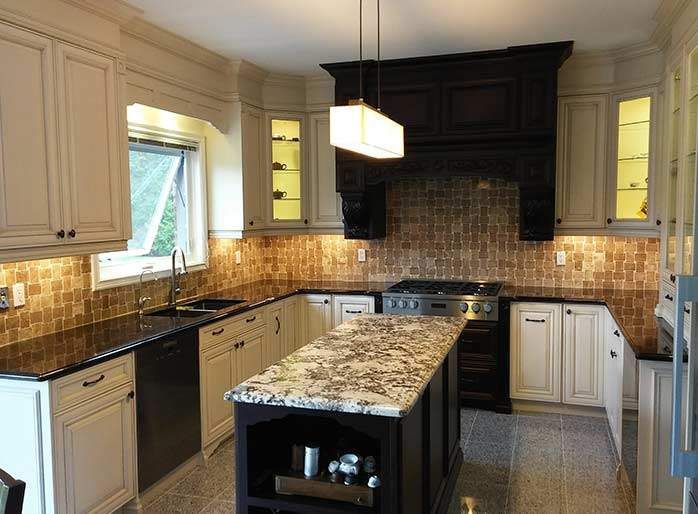 This elegant kitchen renovation by Reno Compass showcases custom cabinetry, a spacious granite island, and a stylish tile backsplash that adds warmth and texture to the space. Designed for both functionality and visual appeal, the layout maximizes storage and workflow while creating a bright and welcoming cooking environment. As a professional Toronto renovation contractor, Reno Compass specializes in high-quality kitchen remodeling, delivering durable materials, modern finishes, and expertly crafted details for homeowners across the GTA.