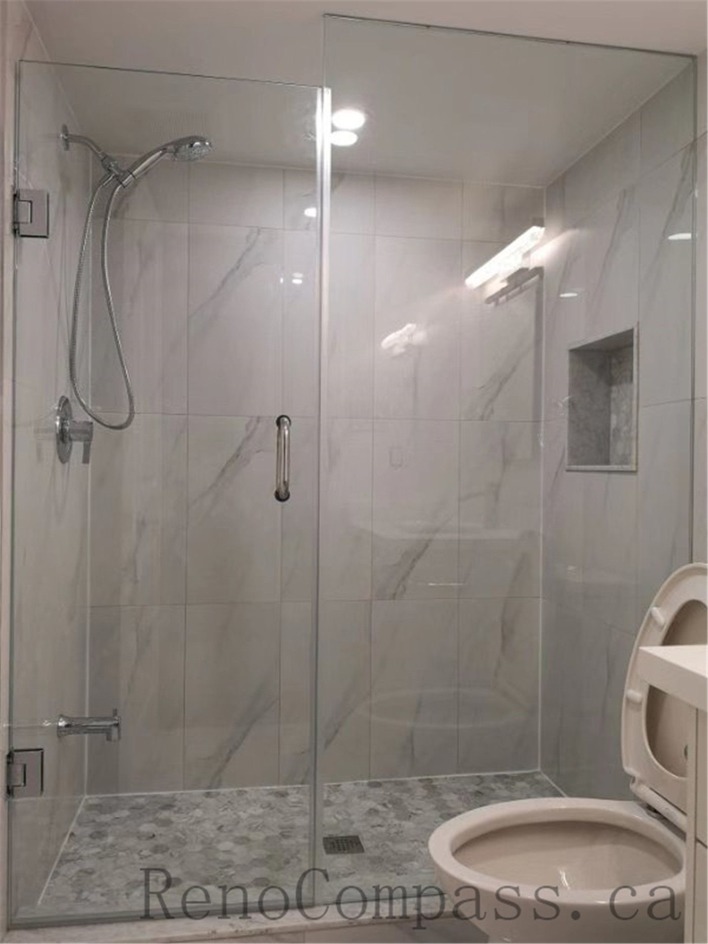 This Aurora basement renovation features a stylish glass wall, creating an open and contemporary layout. The bright design enhances light flow and modernizes the space — completed by Reno Compass.