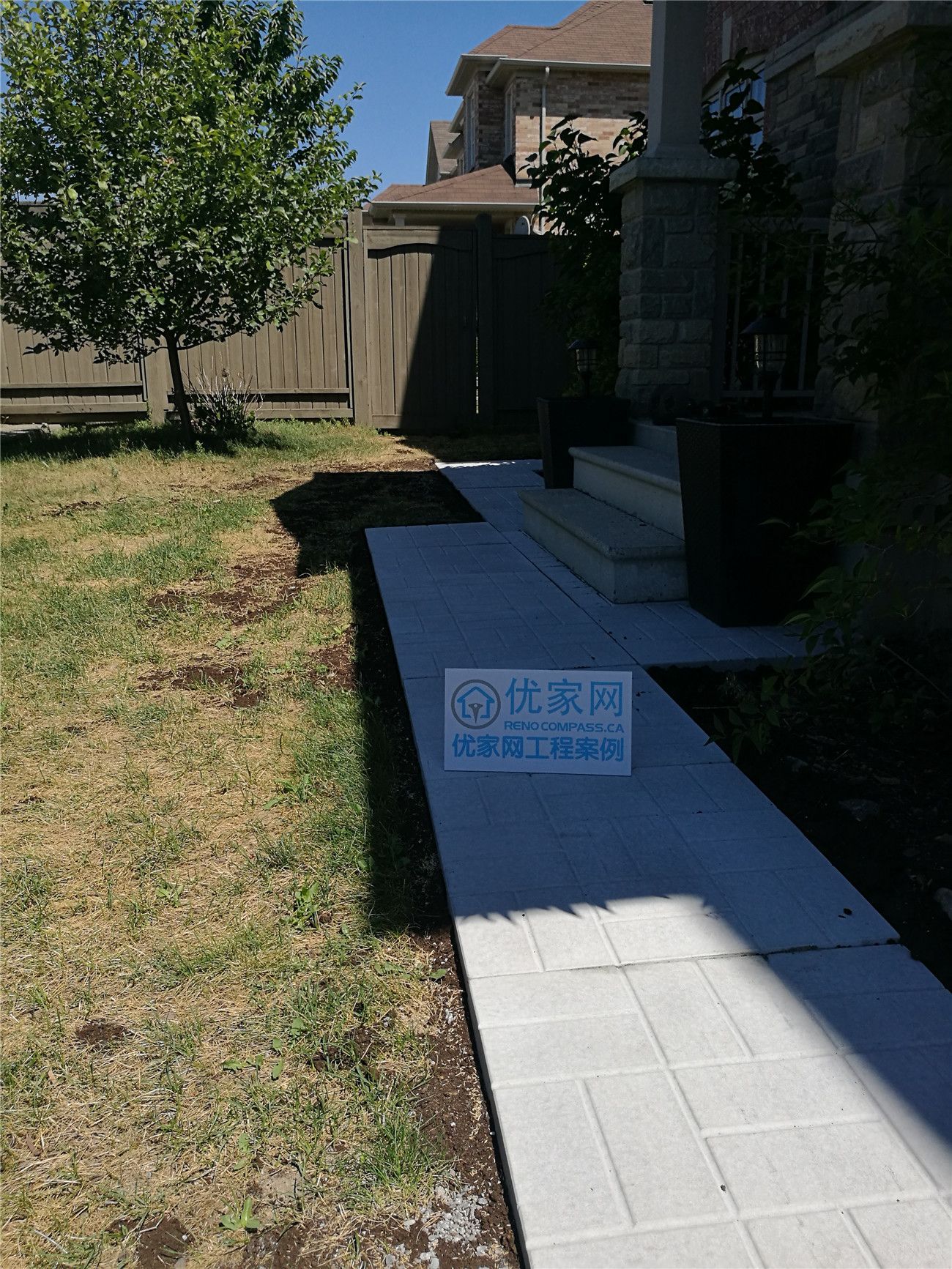 A clean and functional garden interlock walkway installed in Vaughan, featuring light-colored concrete pavers for a modern and low-maintenance front yard landscape. This interlocking pathway improves accessibility, drainage, and overall curb appeal, seamlessly connecting the entrance steps with the garden area. Ideal for homeowners looking for durable and elegant landscaping solutions in Vaughan.