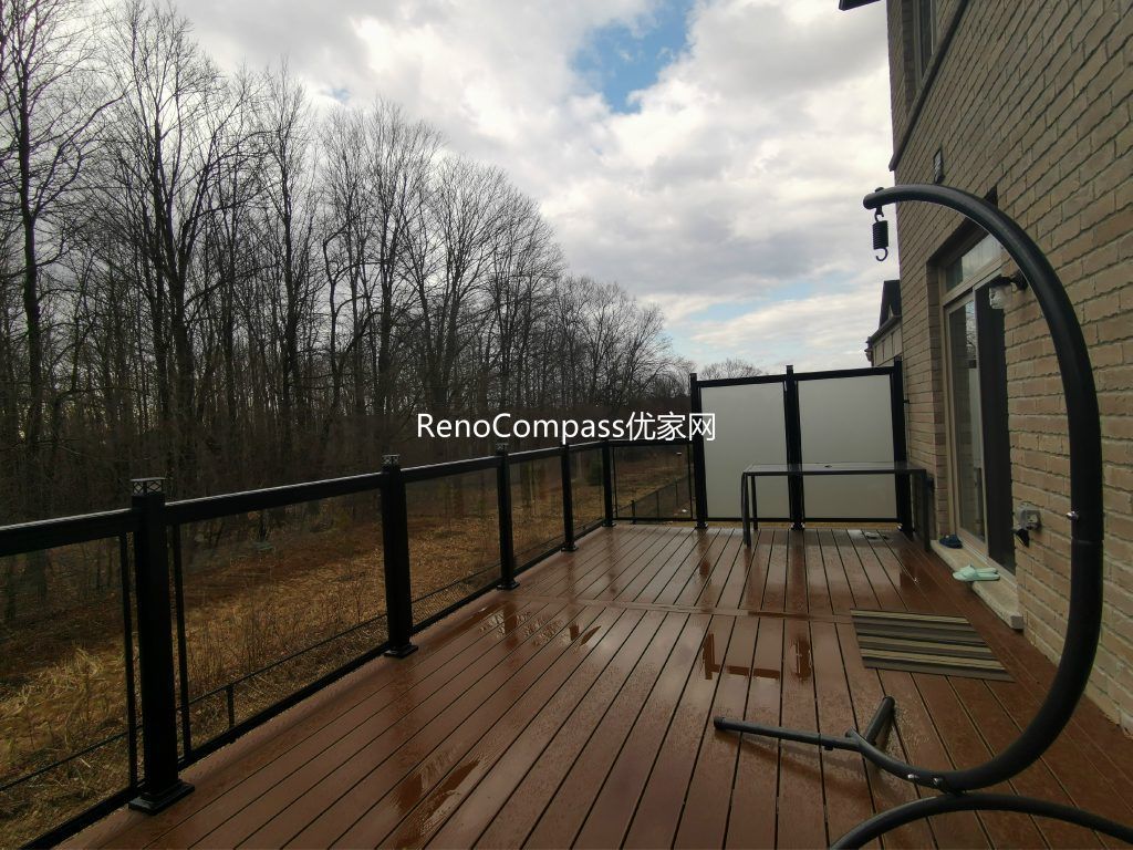 Professional deck construction project in Aurora featuring durable composite wood decking, modern black aluminum and glass railings, and a spacious outdoor layout. Designed for long-term durability and low maintenance, this backyard deck enhances outdoor comfort, safety, and property value.
