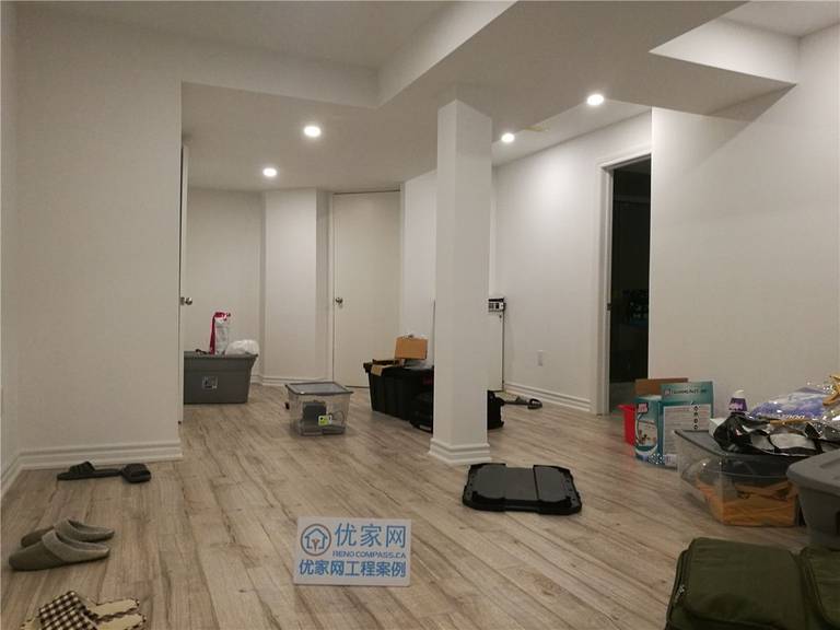 Finished basement interior renovation in Richmond Hill featuring open-concept layout, upgraded flooring, smooth ceiling with recessed pot lights, and structural columns seamlessly integrated into the space. Completed by a professional Toronto renovation company, this basement renovation improves functionality, brightness, and overall livability.