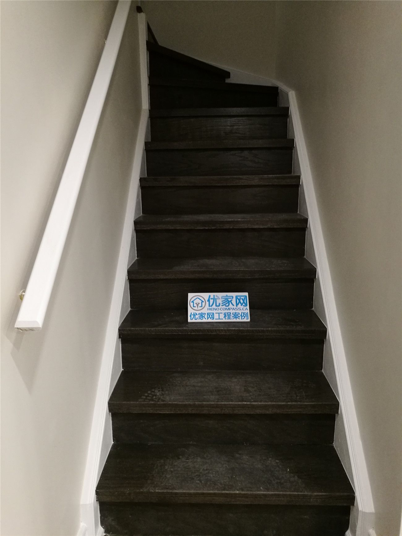 This Scarborough basement renovation includes a newly finished staircase featuring dark wood steps, clean white railings, and a modern neutral color palette. The updated stairway provides a safe and stylish transition between levels while complementing the overall basement design. Built for durability and everyday use, the staircase enhances both function and visual appeal. Completed by a professional Toronto renovation company, this project highlights quality craftsmanship and thoughtful basement renovation details.
