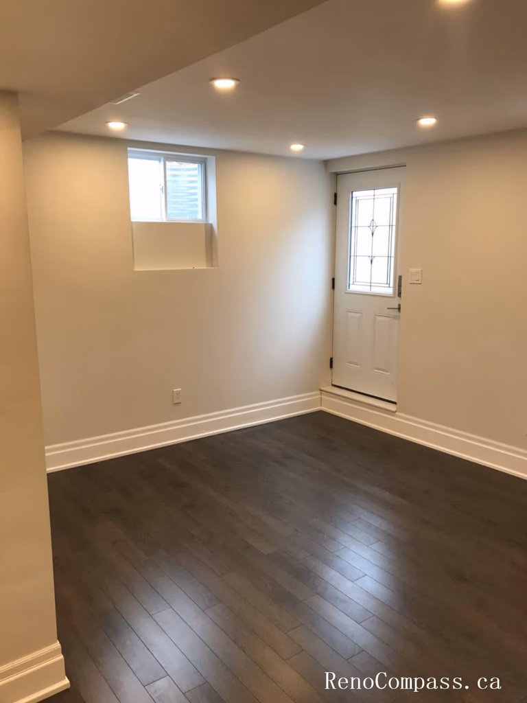 Completed basement renovation in Richmond Hill featuring upgraded hardwood flooring, recessed lighting, and a clean modern layout. This finished basement space improves functionality and comfort, providing additional living or recreational area while enhancing overall home value and interior appeal.