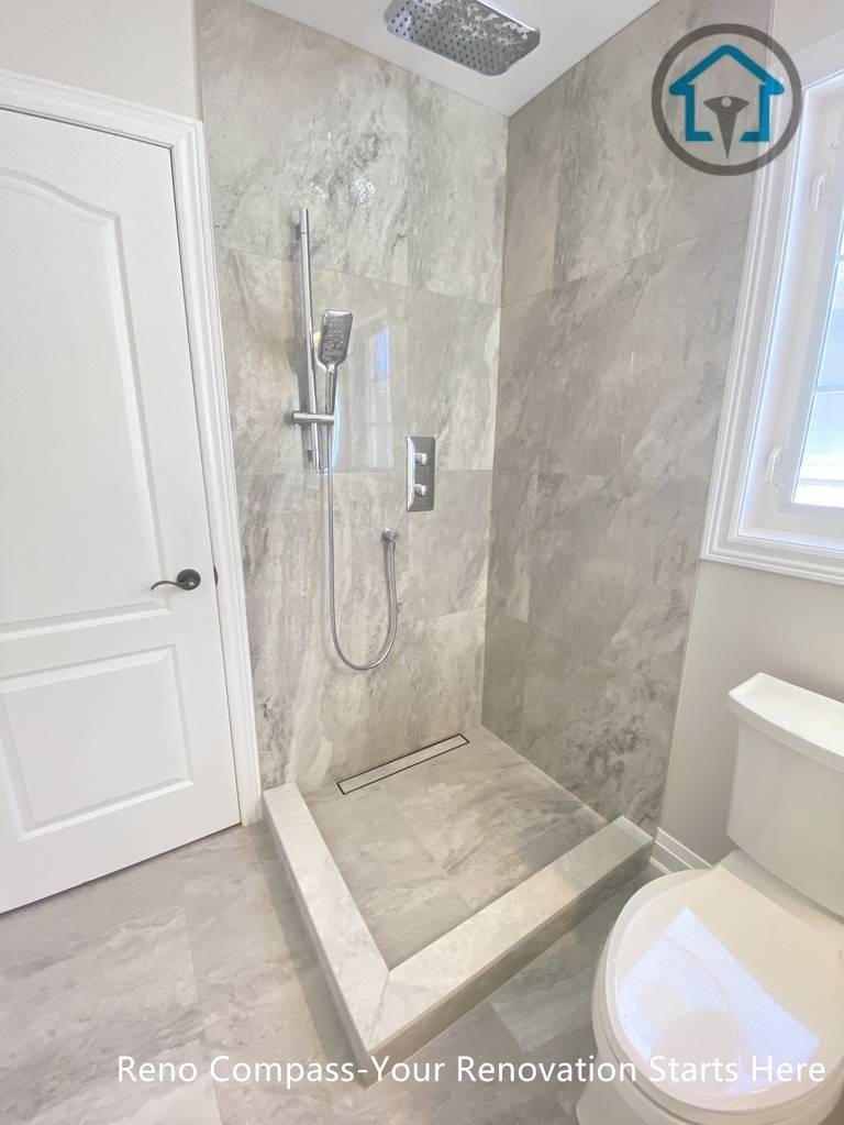 This Richmond Hill bathroom renovation features a walk-in shower with full-height tile walls, a recessed shower base, and modern fixtures. The clean layout and durable finishes improve everyday usability while maintaining a modern residential bathroom design, completed by a trusted Toronto renovation company.