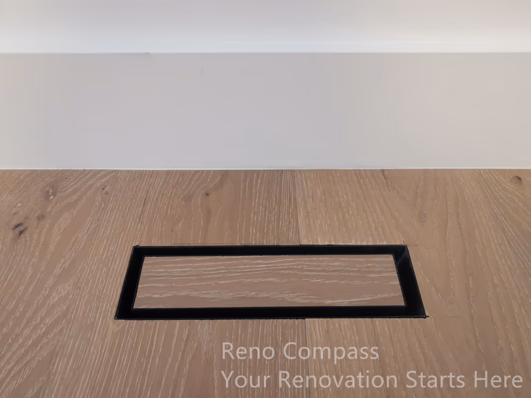 This image highlights a flush-mounted floor vent detail completed as part of a Markham interior renovation. The vent is carefully integrated into the wood flooring, with a slim black frame that aligns cleanly with the surrounding planks. This detail-oriented approach minimizes visual disruption while maintaining proper airflow and functionality. By aligning mechanical elements seamlessly with finished surfaces, the renovation achieves a refined, modern look that reflects precision workmanship and thoughtful interior planning.
