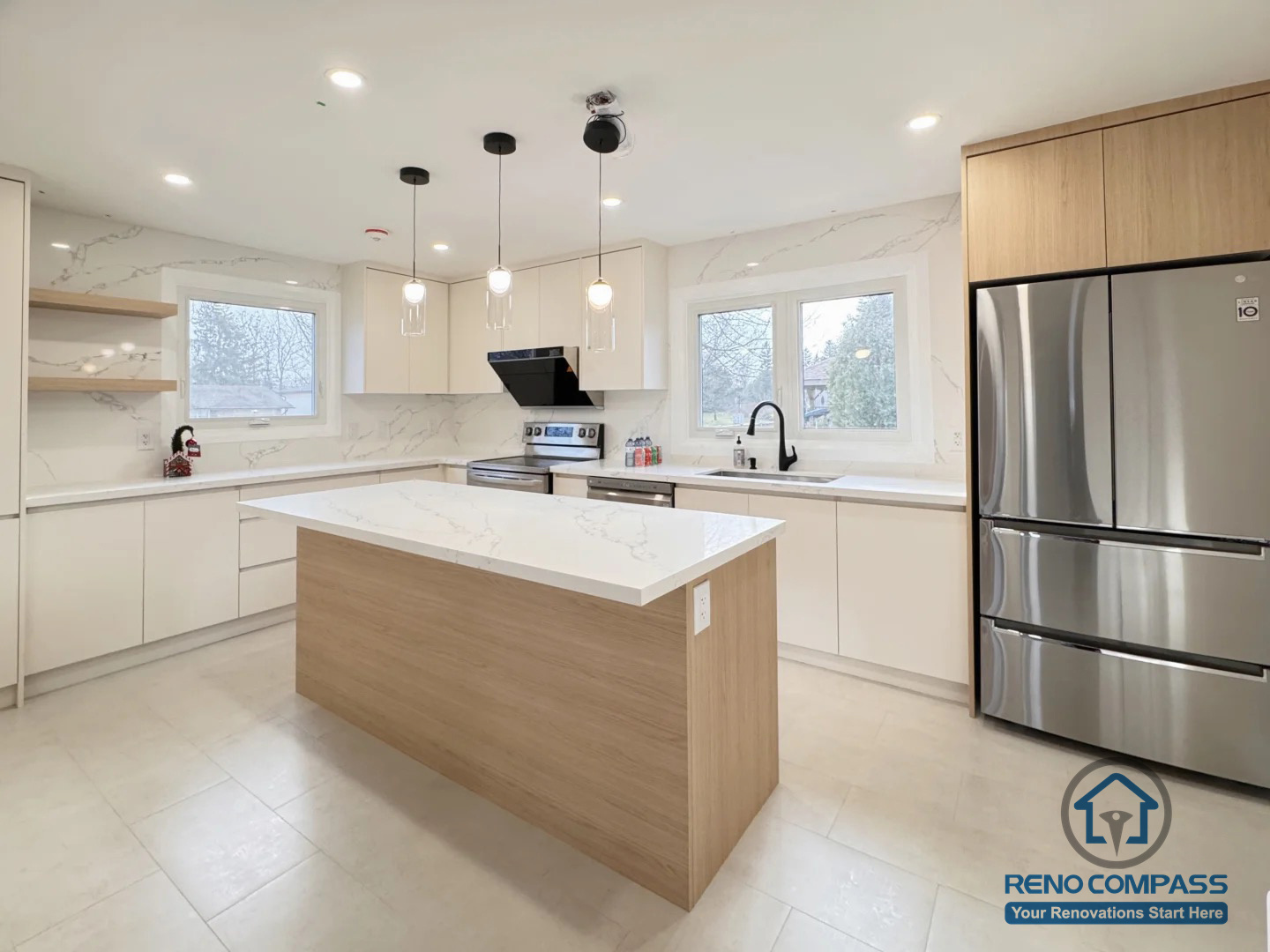 This Oakville interior renovation features a modern kitchen centered around a functional island that enhances both workflow and visual balance. Clean cabinetry, quartz countertops, and soft pendant lighting work together to create a bright, open, and well-organized space. The layout maximizes natural light and provides a seamless connection between cooking, preparation, and everyday use.