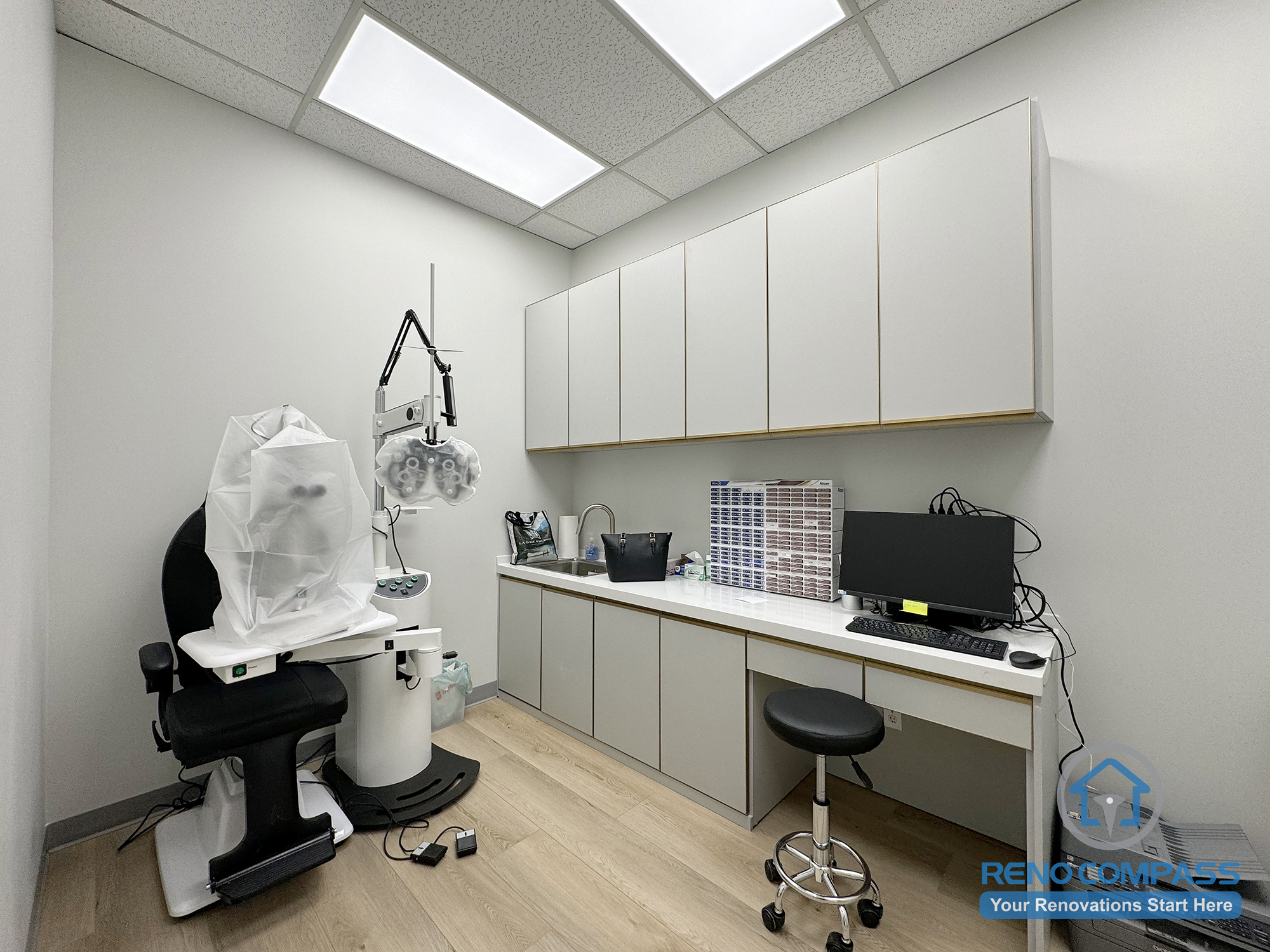 This Mississauga optical exam room renovation includes custom-built cabinetry, integrated work surfaces, and professional-grade lighting designed for eye examination use. The clean, efficient layout supports clinical functionality while maintaining a modern, organized commercial interior environment.