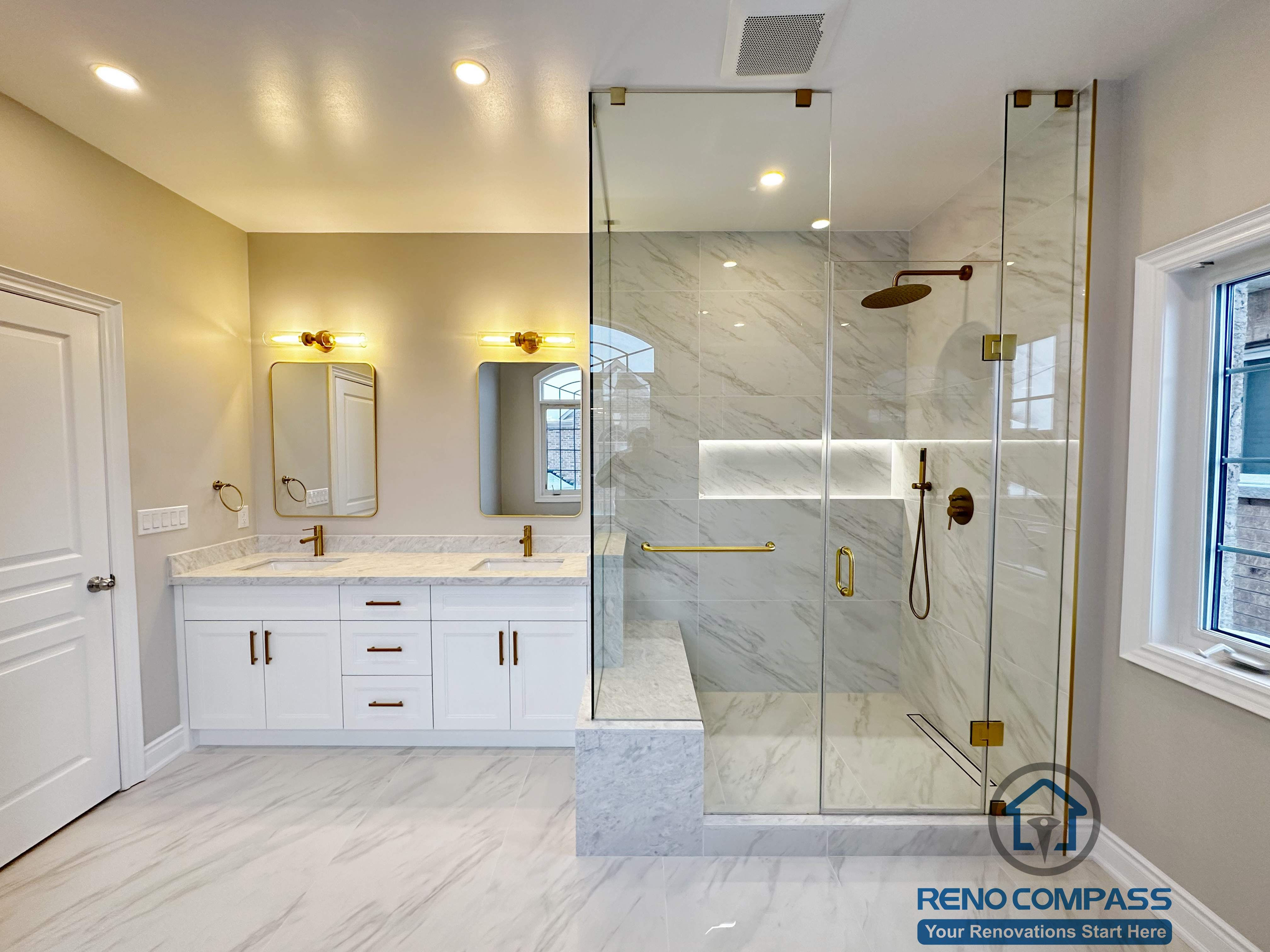 Full view of a Vaughan primary bathroom renovation showcasing a custom double vanity with quartz countertop, gold fixtures, LED mirror lighting, and a frameless glass walk-in shower finished with marble-look porcelain tile. The layout maximizes light, storage, and circulation, completed by a professional Toronto renovation company specializing in high-end bathroom design.