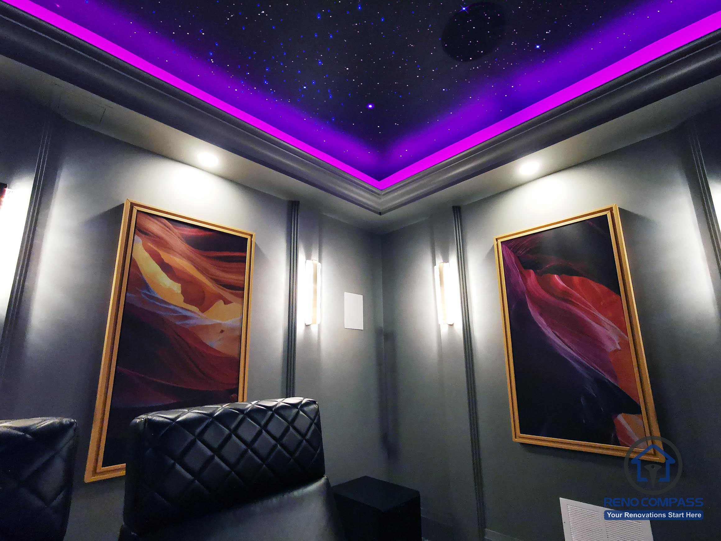 Detail view of a home theatre renovation in Aurora highlighting a star ceiling, ambient LED cove lighting, and custom wall art that enhances the cinematic atmosphere.