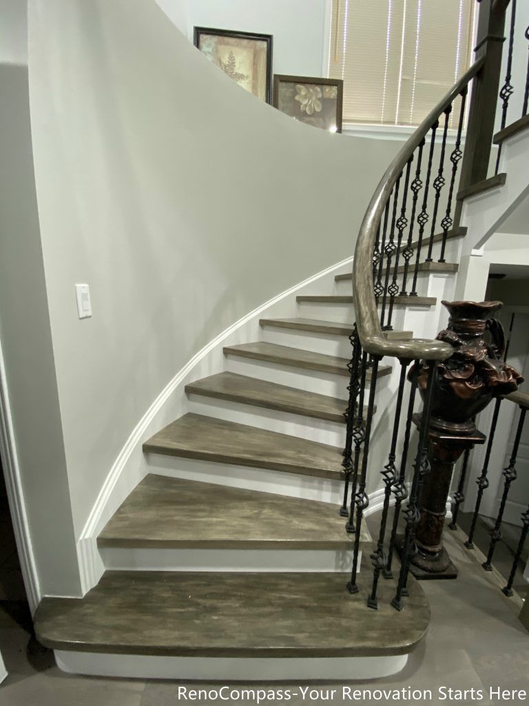 This Mississauga interior renovation features a beautifully crafted curved staircase with custom wood treads, modern iron balusters, and elegant trim detailing. The upgraded staircase enhances the home’s architectural character while improving durability and safety. Paired with new flooring and clean contemporary finishes, the design creates a striking focal point that connects multiple levels seamlessly. Completed by a professional Toronto renovation company, this renovation highlights quality craftsmanship and modern interior design that elevates both visual appeal and property value.