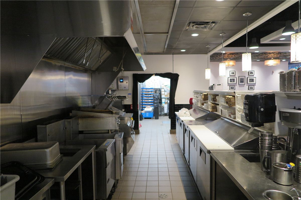 This Toronto restaurant renovation project showcases a fully upgraded commercial kitchen and front service counter area completed by Reno Compass Inc. The scope of work included stainless steel prep stations, commercial-grade ventilation hood installation, new ceiling lighting, POS counter setup, and optimized kitchen workflow layout.

The redesigned space improves operational efficiency, hygiene standards, and customer service flow. Durable flooring, modern pendant lighting, and professional-grade equipment installation ensure the restaurant meets commercial safety codes while maintaining a clean and contemporary appearance.

As a trusted Toronto renovation company, Reno Compass Inc. delivers practical and code-compliant restaurant renovation solutions tailored for food service businesses across the GTA.