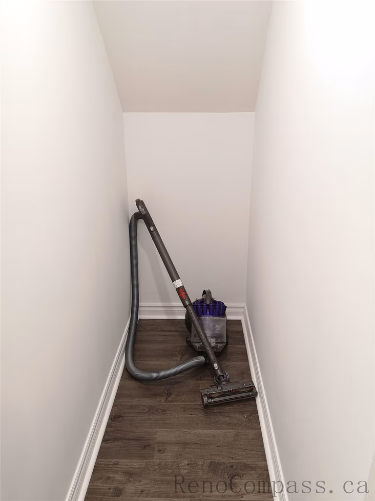 This Richmond Hill basement renovation includes a clean and modern hallway design featuring new interior doors, recessed pot lighting, and durable wood flooring. The neutral wall color and upgraded trim create a bright and cohesive transition between basement rooms. Completed by a trusted Toronto renovation company, Reno Compass Inc., this finished basement hallway enhances both functionality and visual flow throughout the space.