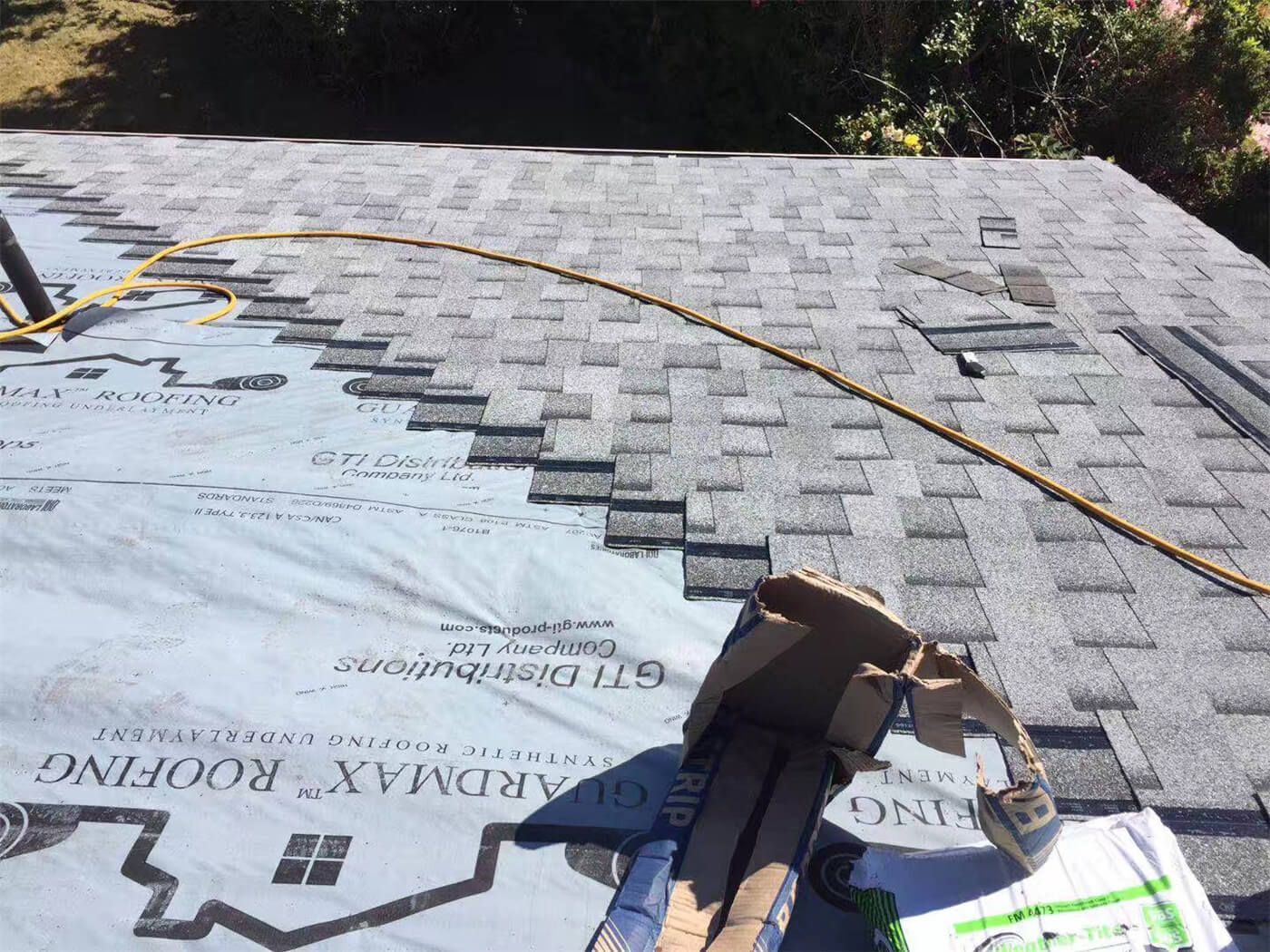 This image features the completed result of a residential roof replacement project in Toronto, showcasing newly installed asphalt shingles with a clean and uniform finish. The upgraded roofing system includes proper ventilation components and carefully aligned shingle placement to ensure long-term durability and protection against Toronto’s changing weather conditions. The project focuses on improving structural reliability, waterproof performance, and overall exterior appearance. Installed by a professional Toronto roofing and renovation team, the new roof enhances curb appeal while providing dependable, energy-efficient protection for the home throughout all seasons.