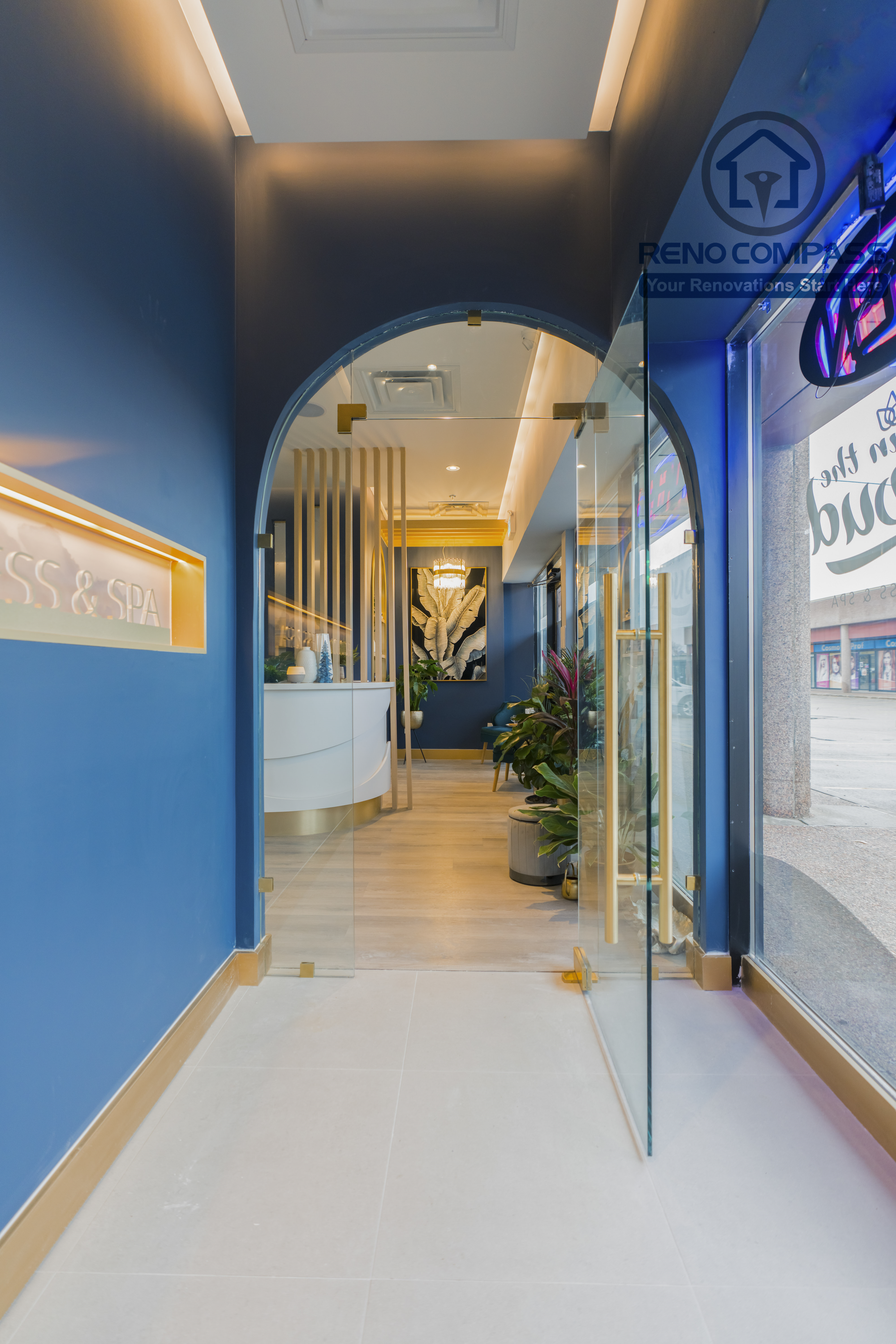 Storefront entrance completed as part of a North York beauty salon renovation. This design features a glass entry door, arched interior transition, branded signage, and clear visual alignment from exterior to reception. The layout creates a strong first impression while guiding clients smoothly into the salon, completed by a professional Toronto renovation company.