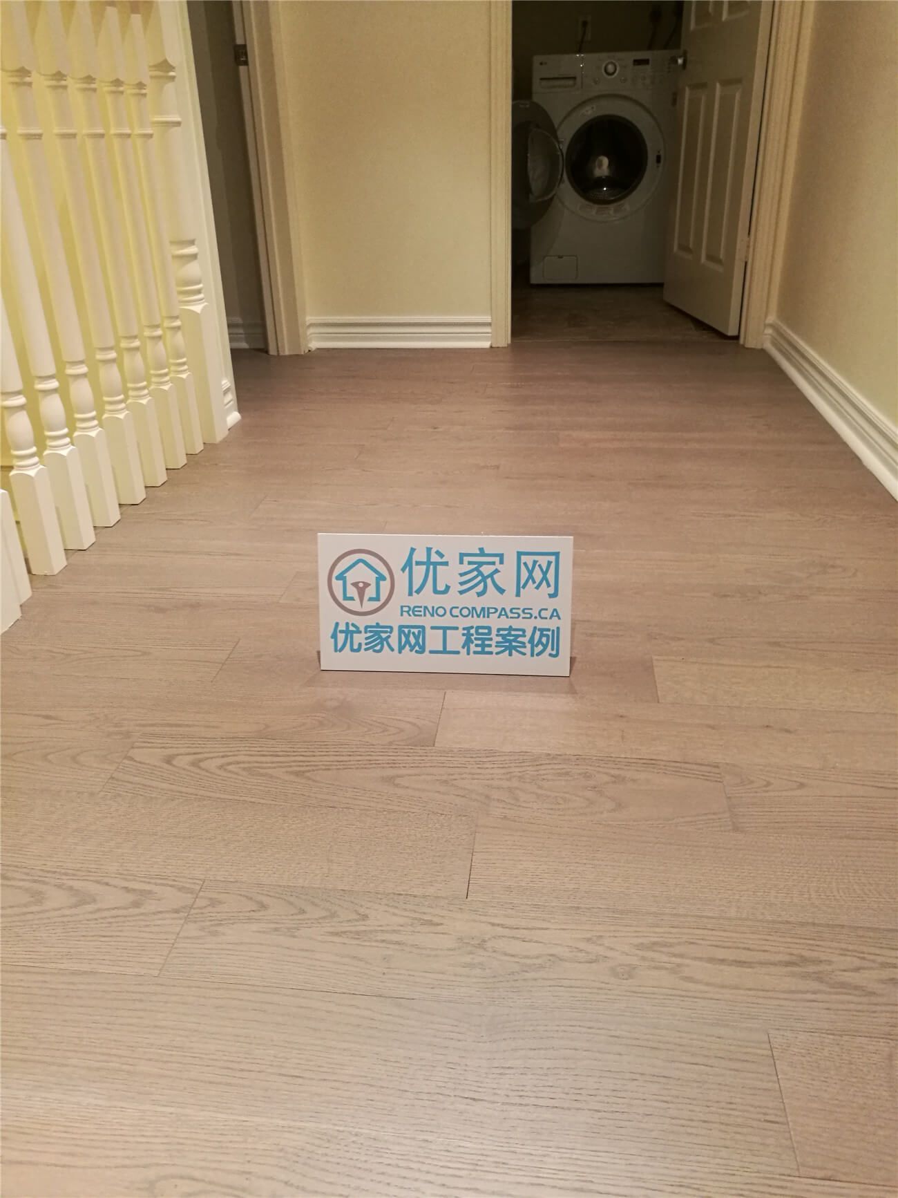 This image showcases a completed flooring installation in North York, featuring engineered wood flooring applied across the main walkway and connecting living areas. The natural wood grain and warm tone enhance visual continuity while providing durability suitable for high-traffic residential spaces. Clean transitions at doorways and baseboards reflect careful installation and attention to detail. This North York flooring renovation highlights quality workmanship and material selection by a professional Toronto renovation company specializing in residential flooring upgrades.