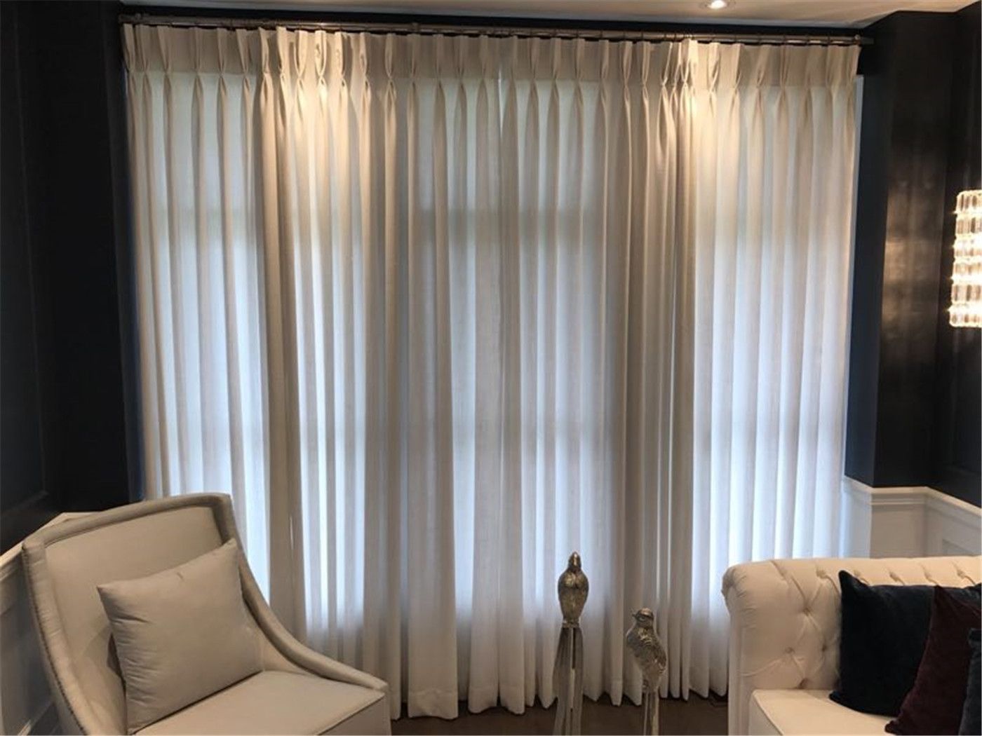 Elegant sheer curtains installed in a Toronto home, featuring full-height drapery that softly diffuses natural light while maintaining privacy. The design enhances the space with a clean, airy, and luxurious atmosphere.