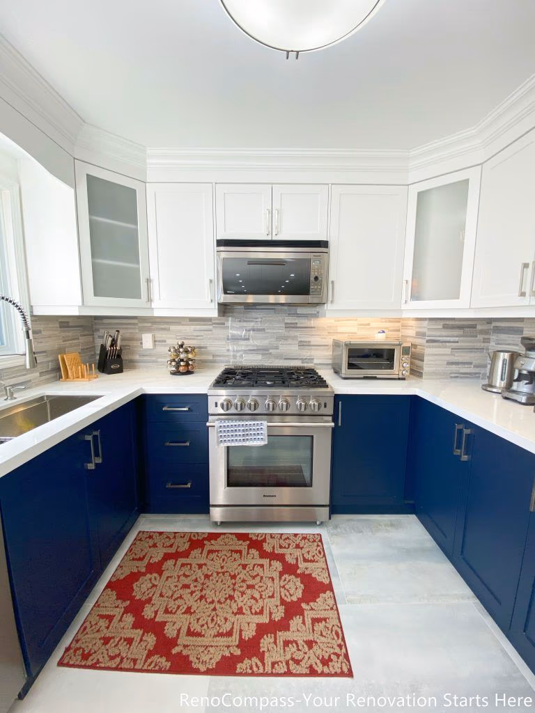 A detailed view of the kitchen cooking area from a Newmarket interior renovation, featuring a gas range, built-in microwave, quartz countertops, and custom cabinetry designed for everyday functionality by a Toronto renovation company.