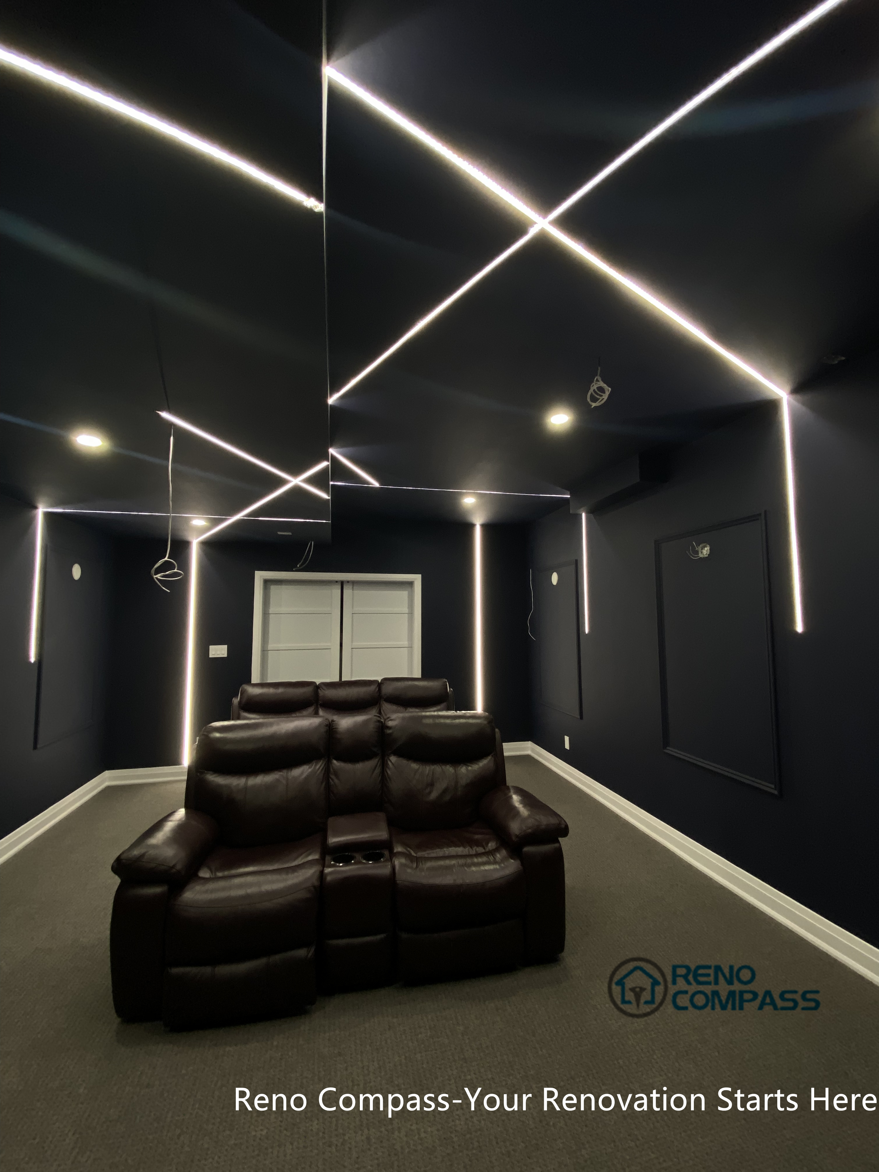 This Newmarket basement home theater renovation features a modern dark-tone design with custom recessed LED ceiling lighting, acoustic wall panels, and a dedicated media seating layout. Designed and built by an experienced Toronto renovation company, this basement transformation delivers a cinematic atmosphere while maintaining comfort, clean lines, and functional lighting control—ideal for family entertainment and private movie nights.