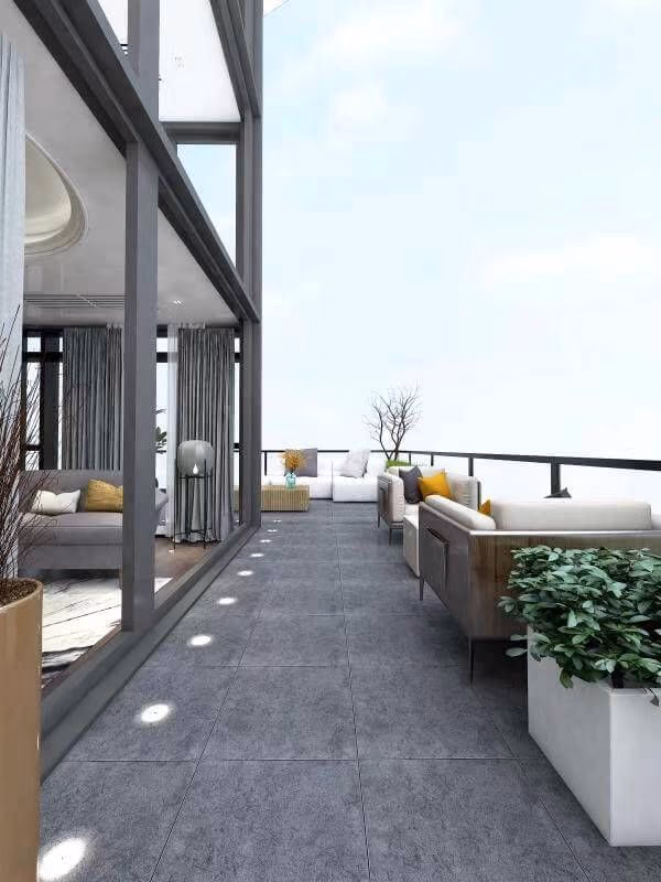 This Toronto interior and outdoor design project extends the living space seamlessly onto a modern terrace featuring large-format outdoor tiles and integrated pathway lighting. Floor-to-ceiling glass panels create a strong indoor–outdoor connection while maximizing natural light. The clean-lined outdoor seating and minimalist railing system enhance the contemporary aesthetic, offering both comfort and expansive views. Designed and completed by Reno Compass Inc., this terrace demonstrates thoughtful spatial planning and refined exterior detailing.