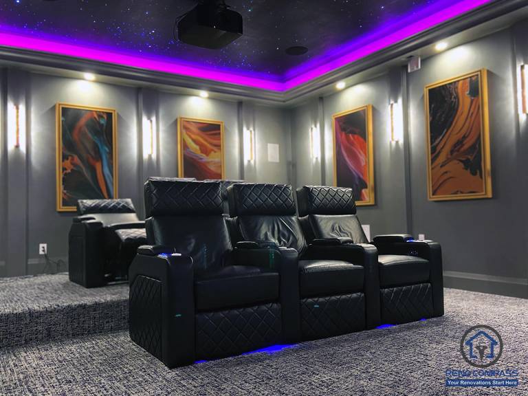 Full view of a custom home theatre renovation in Aurora featuring tiered seating, star ceiling, ambient LED lighting, and a large projection screen for immersive entertainment.