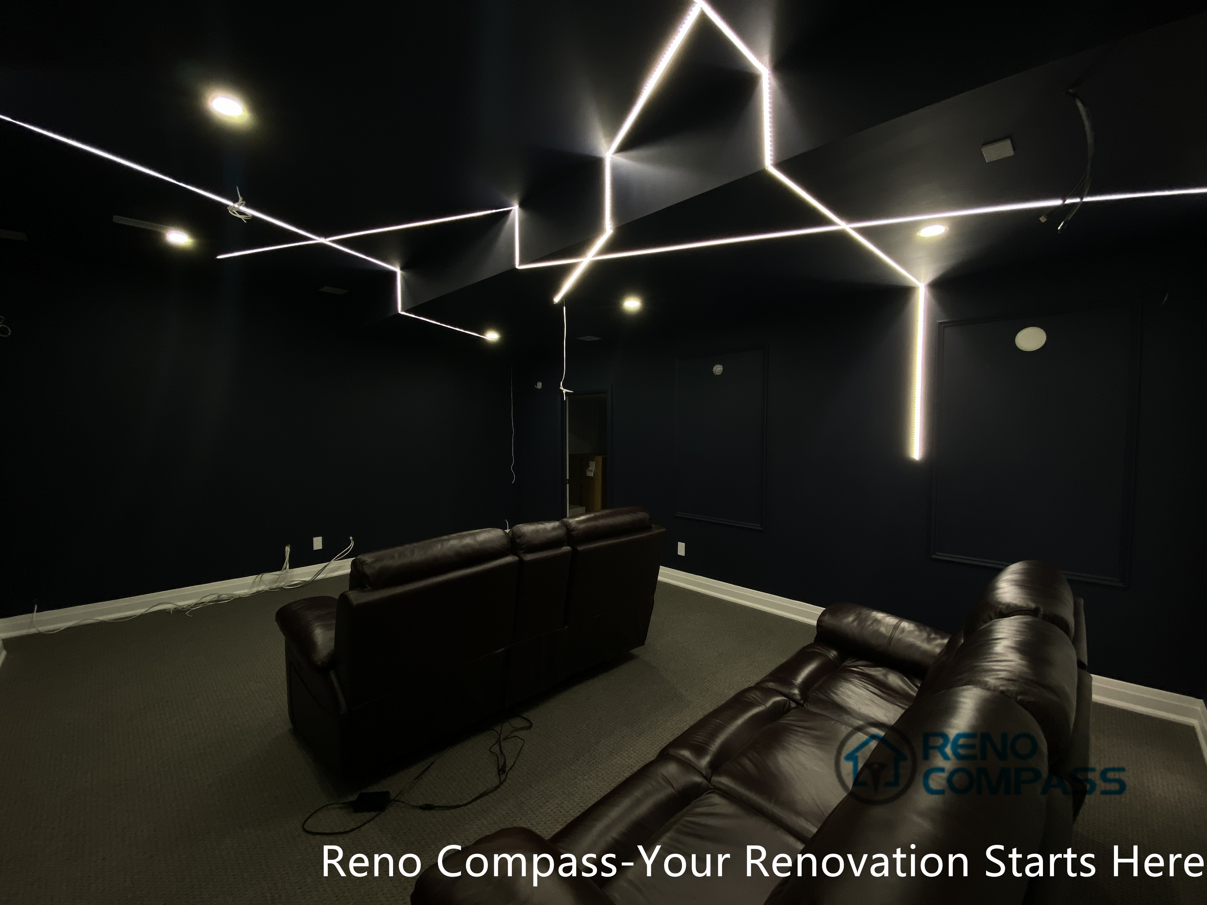 This Newmarket basement home theater renovation features a modern dark-tone design with custom recessed LED ceiling lighting, acoustic wall panels, and a dedicated media seating layout. Designed and built by an experienced Toronto renovation company, this basement transformation delivers a cinematic atmosphere while maintaining comfort, clean lines, and functional lighting control—ideal for family entertainment and private movie nights.