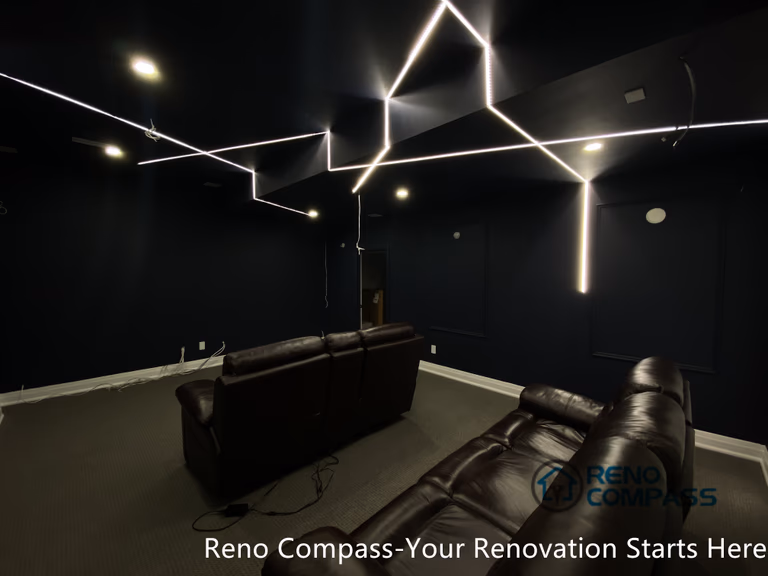 This Newmarket basement home theater renovation features a modern dark-tone design with custom recessed LED ceiling lighting, acoustic wall panels, and a dedicated media seating layout. Designed and built by an experienced Toronto renovation company, this basement transformation delivers a cinematic atmosphere while maintaining comfort, clean lines, and functional lighting control—ideal for family entertainment and private movie nights.