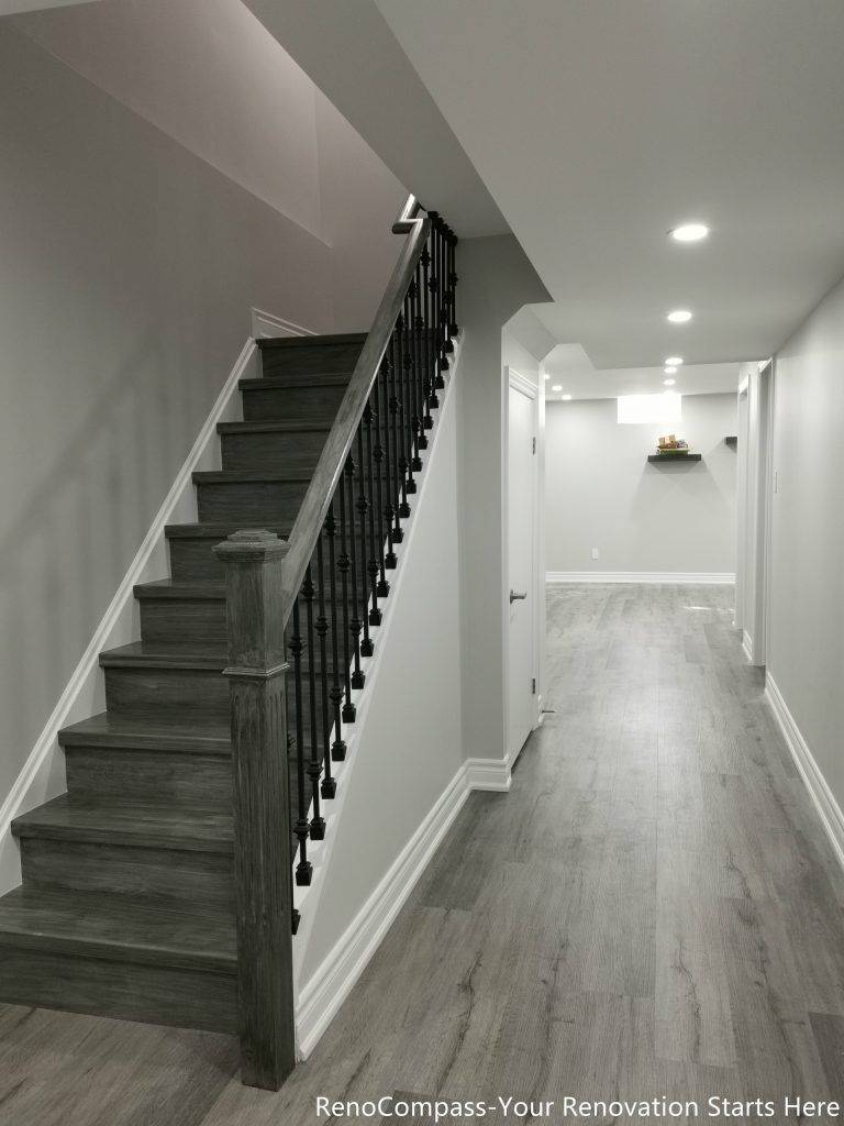This Oakville basement renovation showcases a modern staircase and hallway upgrade with new flooring, fresh wall finishes, and recessed pot lights that brighten the entire lower level. The redesigned layout creates a clean and seamless transition between floors while improving both safety and visual appeal. Completed by a trusted Toronto renovation company, this finished basement upgrade enhances functionality, lighting, and overall home value while delivering a stylish and durable modern living space.