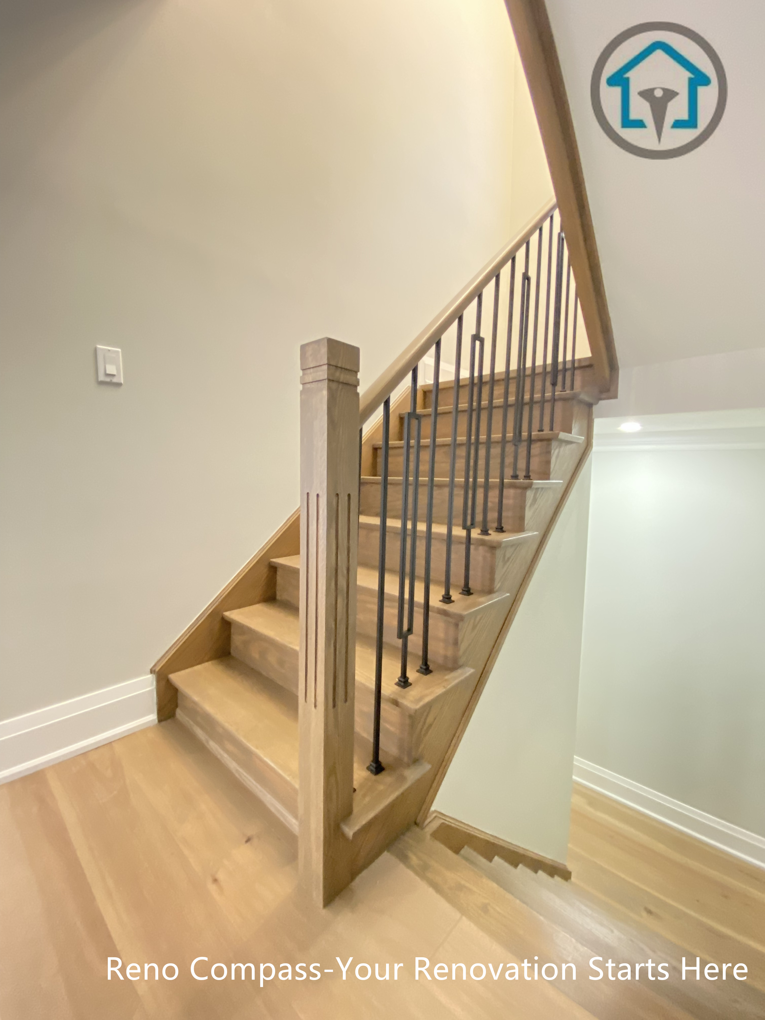 This image showcases a completed flooring and staircase renovation project in Richmond Hill, featuring modern wood stair treads, matching hardwood flooring, and sleek black iron railings. The updated staircase design enhances safety, flow, and visual continuity between levels, creating a bright and contemporary interior look. Completed by an experienced Toronto renovation company, the project focuses on durable materials, clean detailing, and long-term residential use.