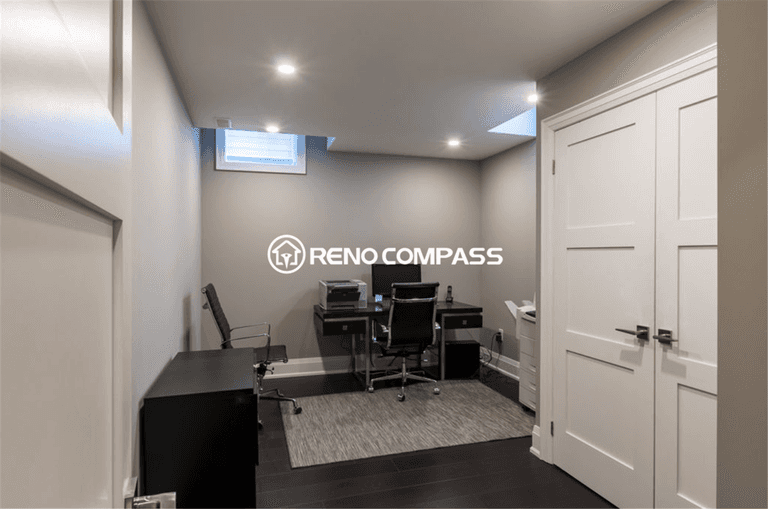 Modern basement home office renovation in Toronto featuring a functional workspace layout, recessed ceiling lighting, large storage cabinet, and dark hardwood flooring. This professionally finished basement office provides a quiet and comfortable work environment, completed by a trusted Toronto renovation company, Reno Compass Inc.