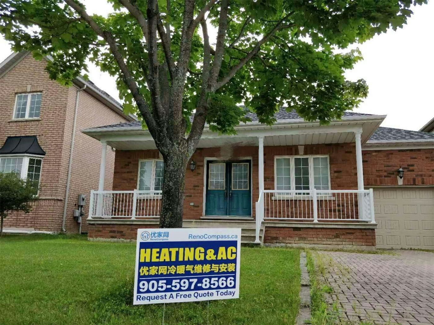 Professional outdoor air conditioner condenser installation by Reno Compass in Toronto. This energy-efficient HVAC unit is securely mounted on a raised stand with proper drainage and ventilation clearance, ensuring optimal cooling performance, durability, and safe operation for residential homes. Installed by licensed technicians for long-term reliability and comfort.
