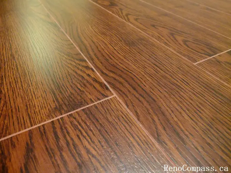 Beautiful dark hardwood flooring installation in a renovated Richmond Hill home. Modern interior design with smooth floor finish and elegant staircase craftsmanship. Completed by RenoCompass.ca for a high-quality residential remodel.
