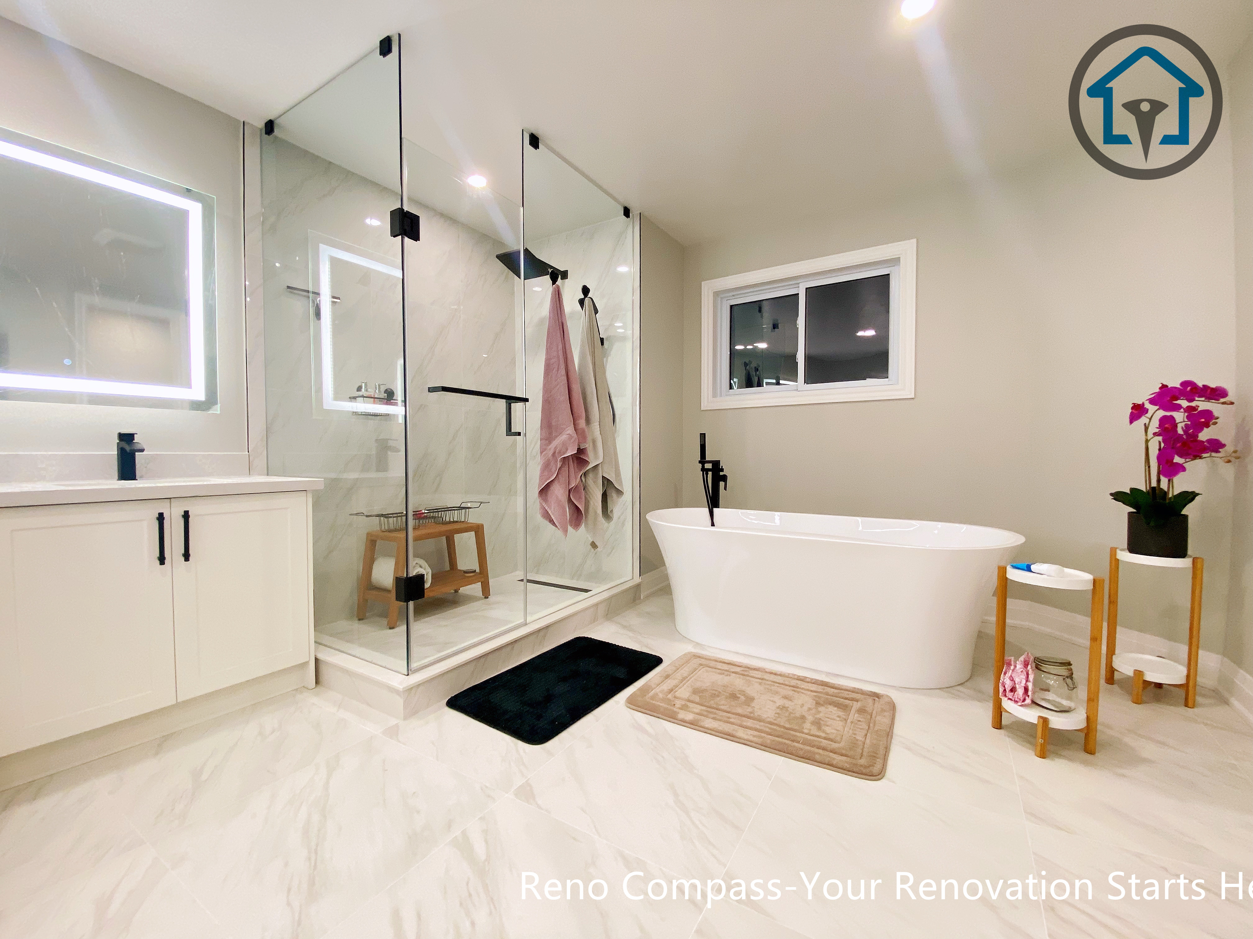 Bright and modern primary bathroom renovation in Newmarket featuring a clean layout, neutral tones, and improved accessibility designed for comfortable long-term living.