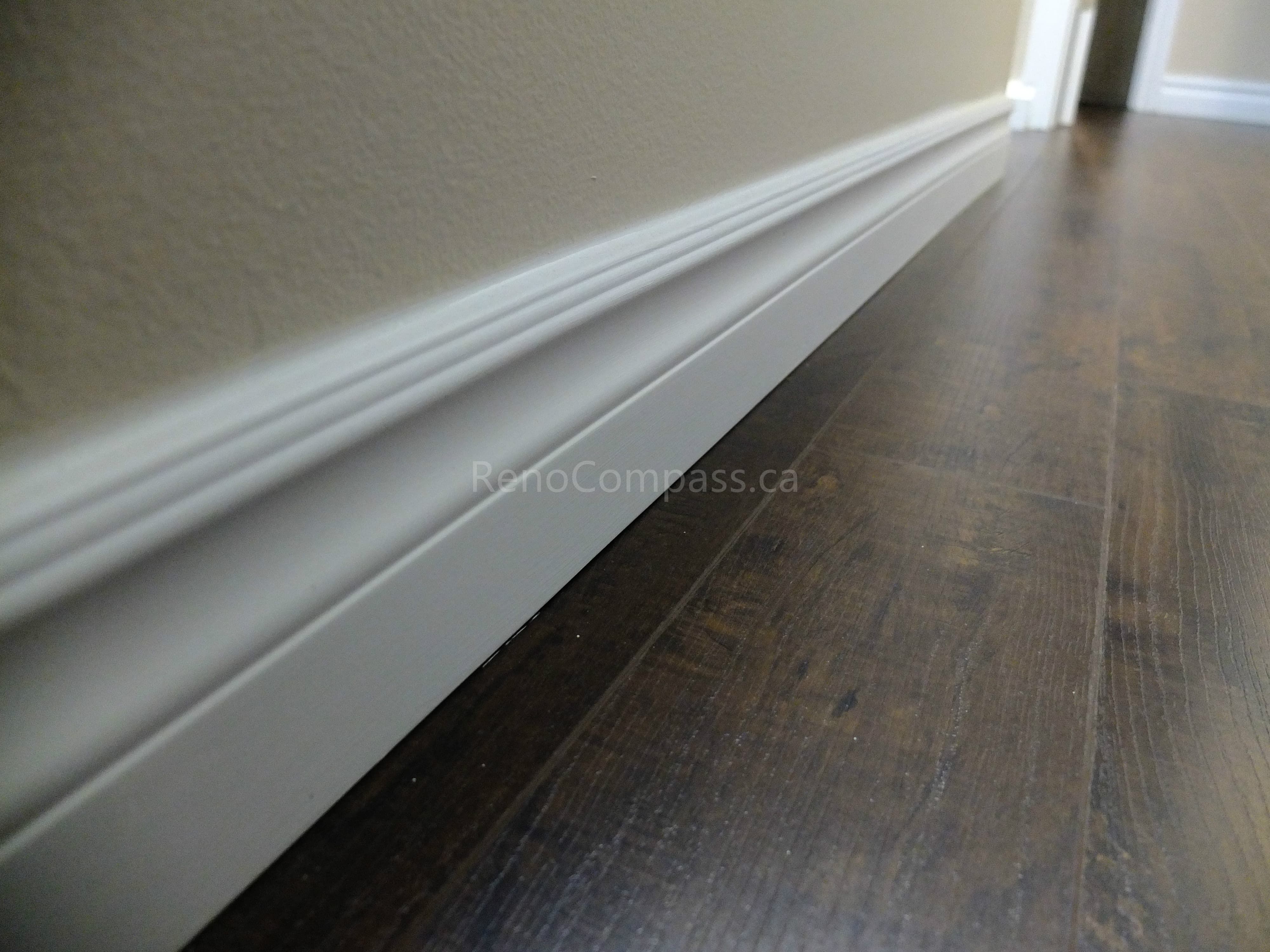 This North York interior renovation detail highlights newly installed modern baseboards paired with durable hardwood flooring, delivering a clean and refined finishing touch throughout the space. Completed by a professional Toronto renovation company, the project focuses on precise trim installation, smooth wall transitions, and high-quality flooring to enhance overall interior aesthetics and long-term durability.