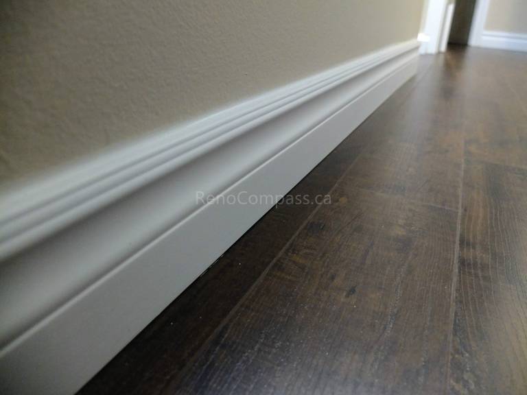 This North York interior renovation detail highlights newly installed modern baseboards paired with durable hardwood flooring, delivering a clean and refined finishing touch throughout the space. Completed by a professional Toronto renovation company, the project focuses on precise trim installation, smooth wall transitions, and high-quality flooring to enhance overall interior aesthetics and long-term durability.