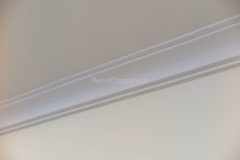 This image features a clean interior trim and crown molding detail completed as part of a North York flooring renovation project. The smooth lines and precise installation create a polished transition between walls and ceilings, enhancing the overall finish of the space. As a reliable Toronto Renovation Company, Reno Compass Inc. pays close attention to finishing details, ensuring flooring, trim, and interior elements work together seamlessly for a refined residential result.