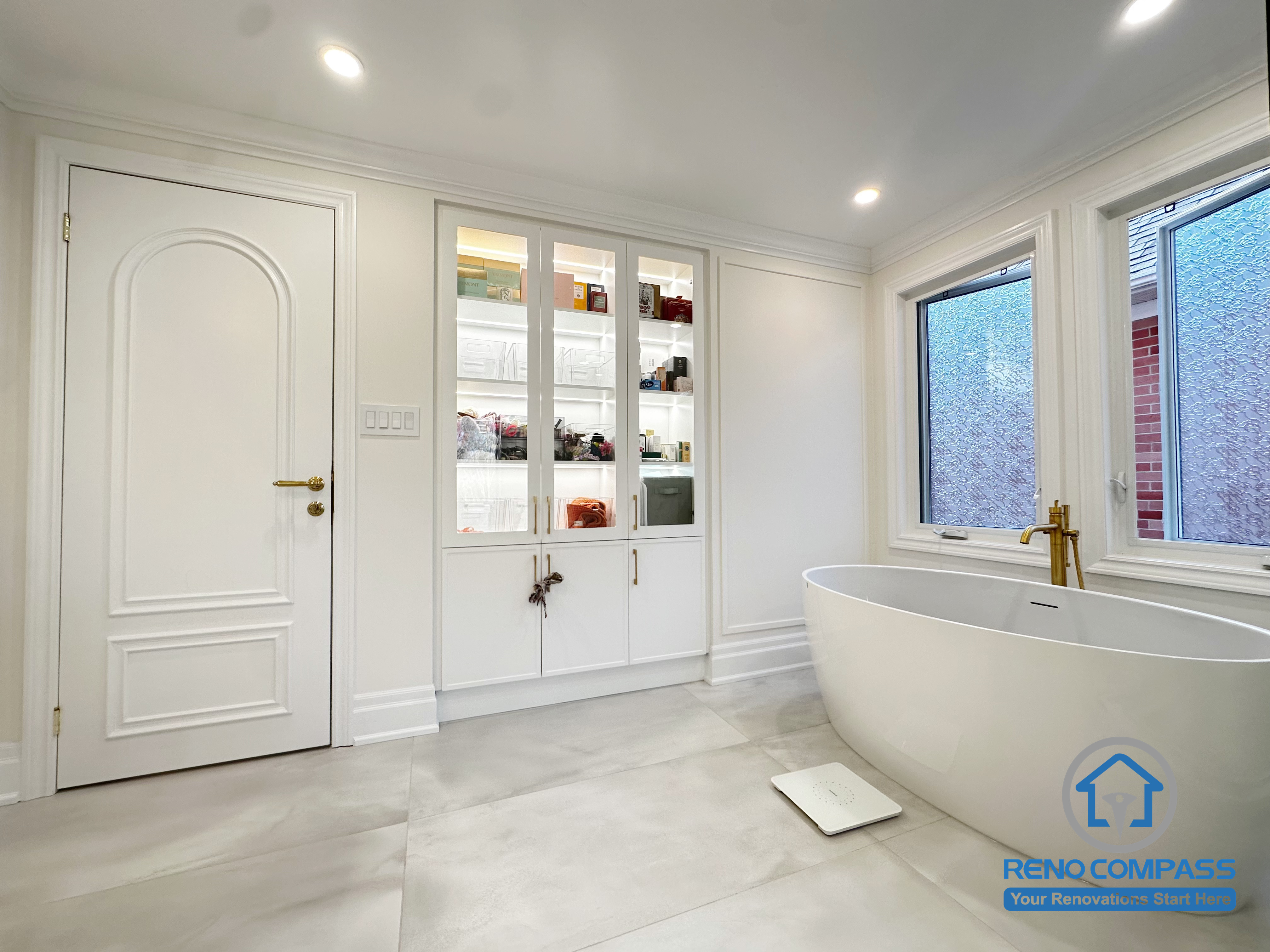 This Markham bathroom renovation focuses on clean lines, spatial balance, and everyday comfort. A freestanding bathtub is positioned to create a calm visual anchor, while custom built-in cabinetry provides concealed storage and keeps the space organized and uncluttered. Soft neutral finishes, refined trim details, and natural light work together to enhance the overall sense of openness and relaxation. The result is a timeless bathroom design that blends functionality with a serene, modern aesthetic.