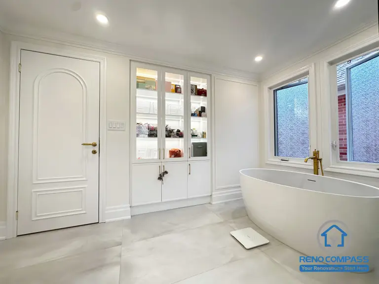 This Markham bathroom renovation focuses on clean lines, spatial balance, and everyday comfort. A freestanding bathtub is positioned to create a calm visual anchor, while custom built-in cabinetry provides concealed storage and keeps the space organized and uncluttered. Soft neutral finishes, refined trim details, and natural light work together to enhance the overall sense of openness and relaxation. The result is a timeless bathroom design that blends functionality with a serene, modern aesthetic.