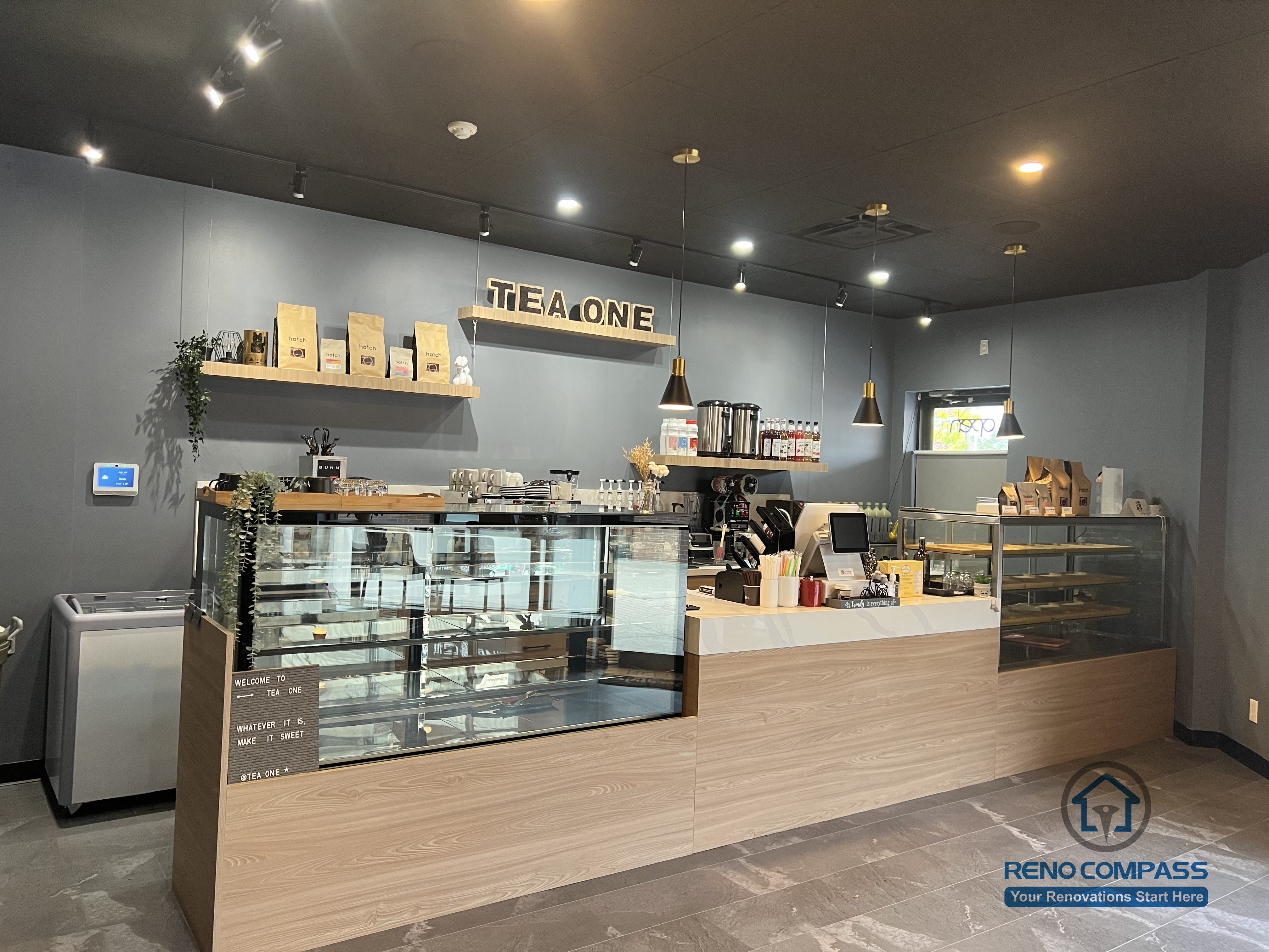 This Mississauga restaurant renovation features a modern front counter and service area with custom millwork, integrated display cases, and ambient lighting. The layout is designed to improve customer flow, enhance ordering efficiency, and create a welcoming commercial dining environment.