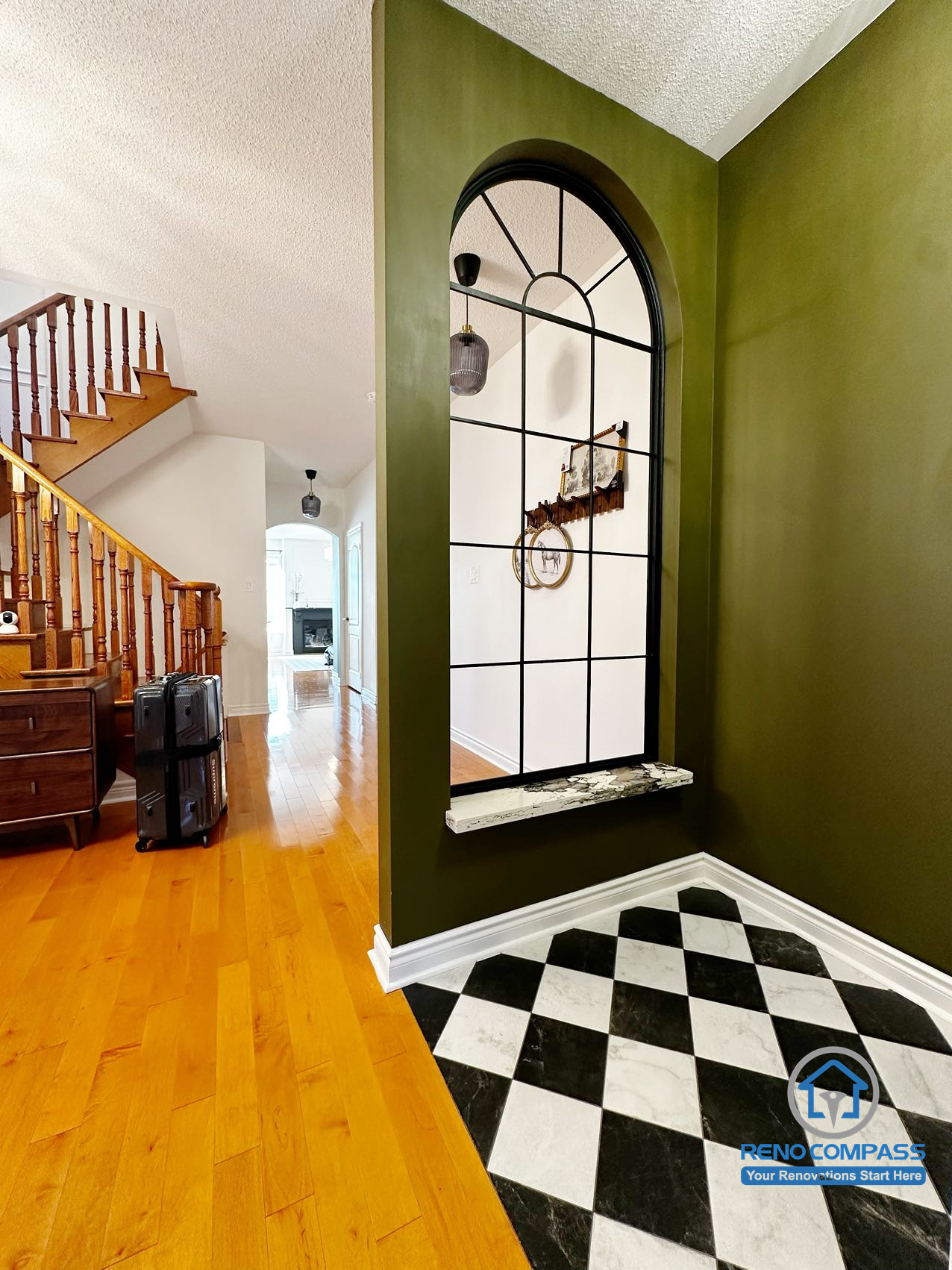Entryway with staircase from a completed interior renovation project in Markham, showing a clean and well-organized interior transition by Reno Compass.