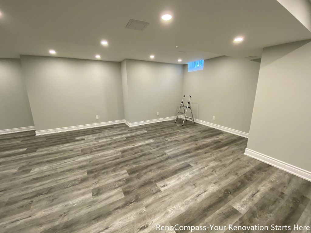 This Richmond Hill basement renovation features a clean modern design with high-quality vinyl flooring, smooth ceiling finishing, and recessed pot lights for a bright and spacious feel. Completed by professional Toronto renovation company Reno Compass Inc., the project transforms the basement into a functional and comfortable living space ideal for family use, rental, or entertainment. The neutral wall tones and durable flooring enhance both aesthetics and long-term value.