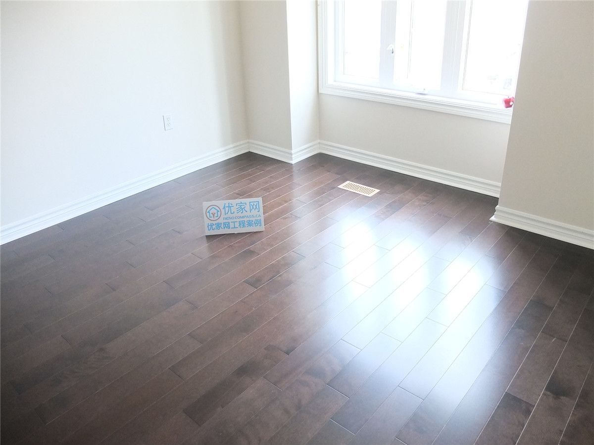 This image showcases the completed whole house flooring installation in Markham, featuring dark hardwood flooring with a clean, seamless finish. The newly installed floors enhance the home’s modern interior, creating a cohesive and elegant look across the main living area. This project reflects professional craftsmanship, precise installation, and high-quality flooring materials suitable for residential renovation projects in the Greater Toronto Area.