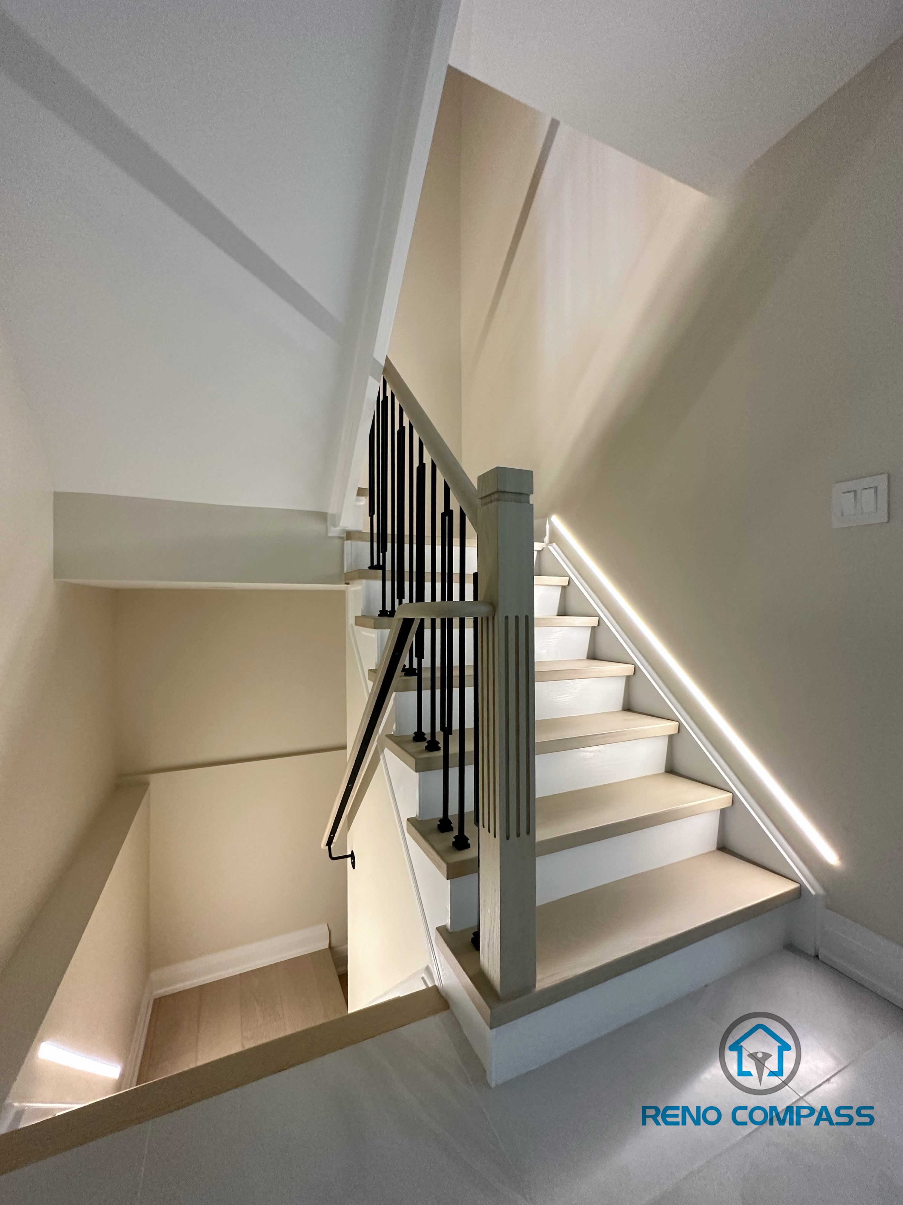 This image showcases our completed light wood staircase renovation in Vaughan. Featuring natural pale wood treads and minimalist metal railings, this design creates a warm, bright, and airy modern feel for the home. We specialize in custom interior renovations across the Greater Toronto and Vaughan area.