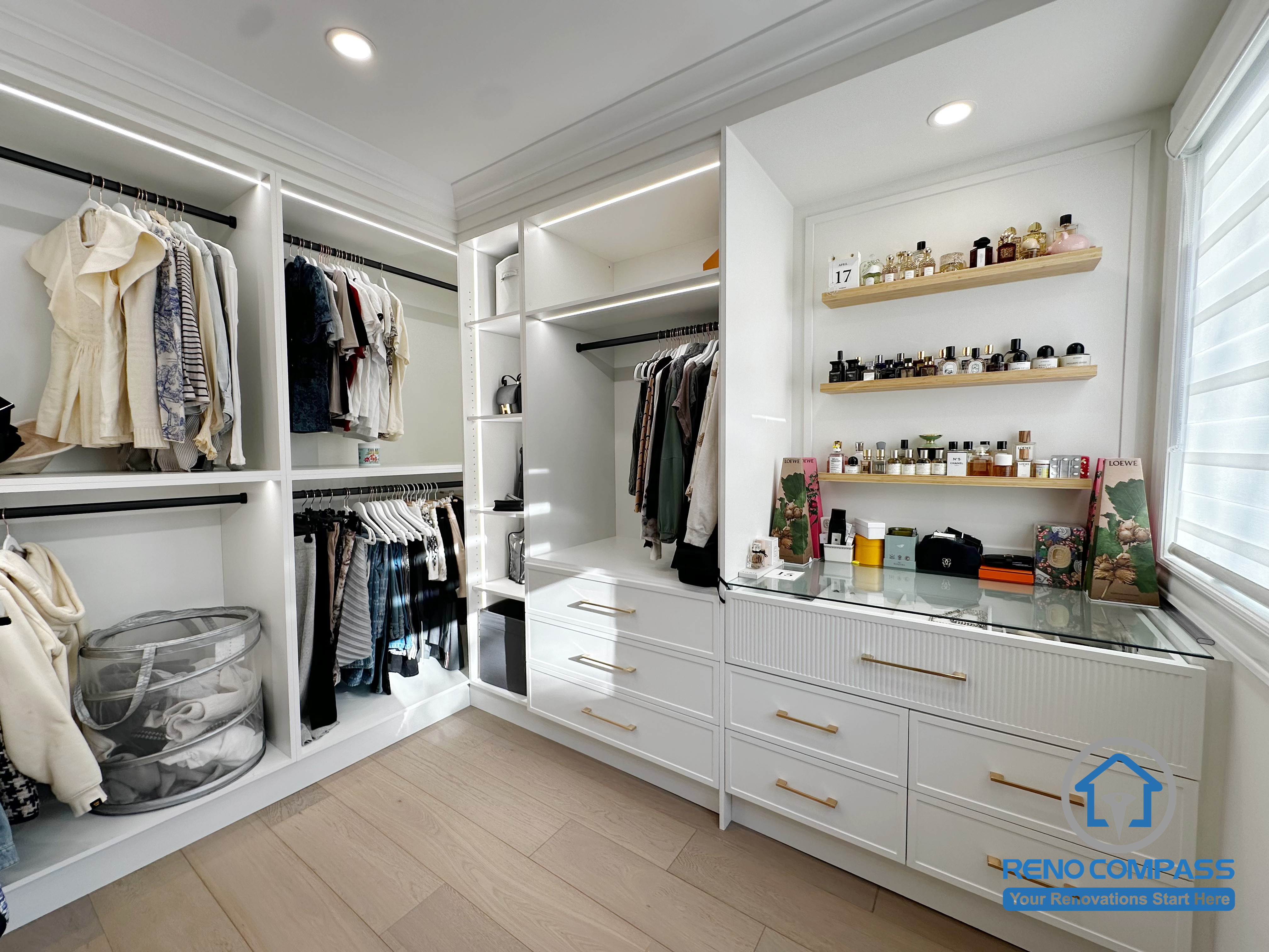 This custom walk-in closet was designed as part of a comprehensive interior renovation in Markham. The layout focuses on maximizing storage efficiency through built-in cabinetry, open hanging sections, and integrated drawer systems. LED strip lighting was incorporated to improve visibility and highlight the organization of the space, while clean millwork lines and consistent finishes create a bright, orderly environment that supports daily use and long-term functionality.