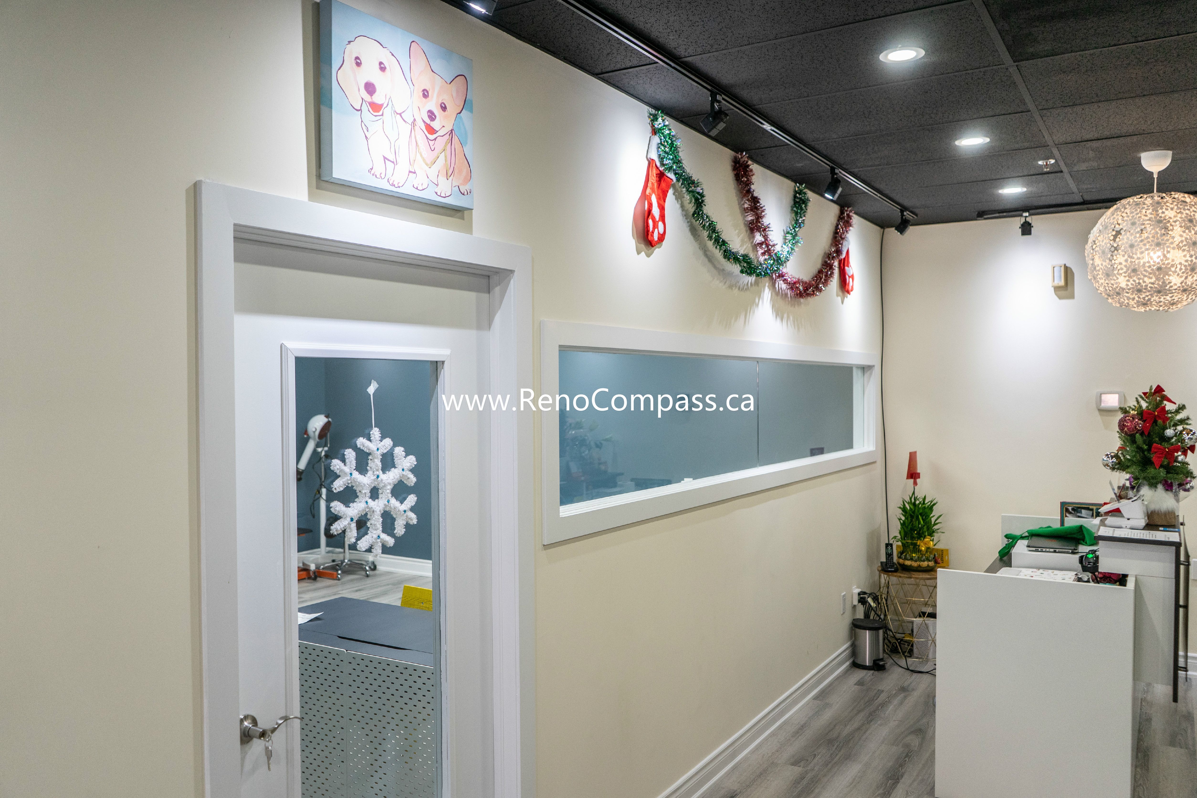 Renovated hallway and service area featuring new lighting, clean tiled walls, and professional finishes at Q’s Pets in Richmond Hill.